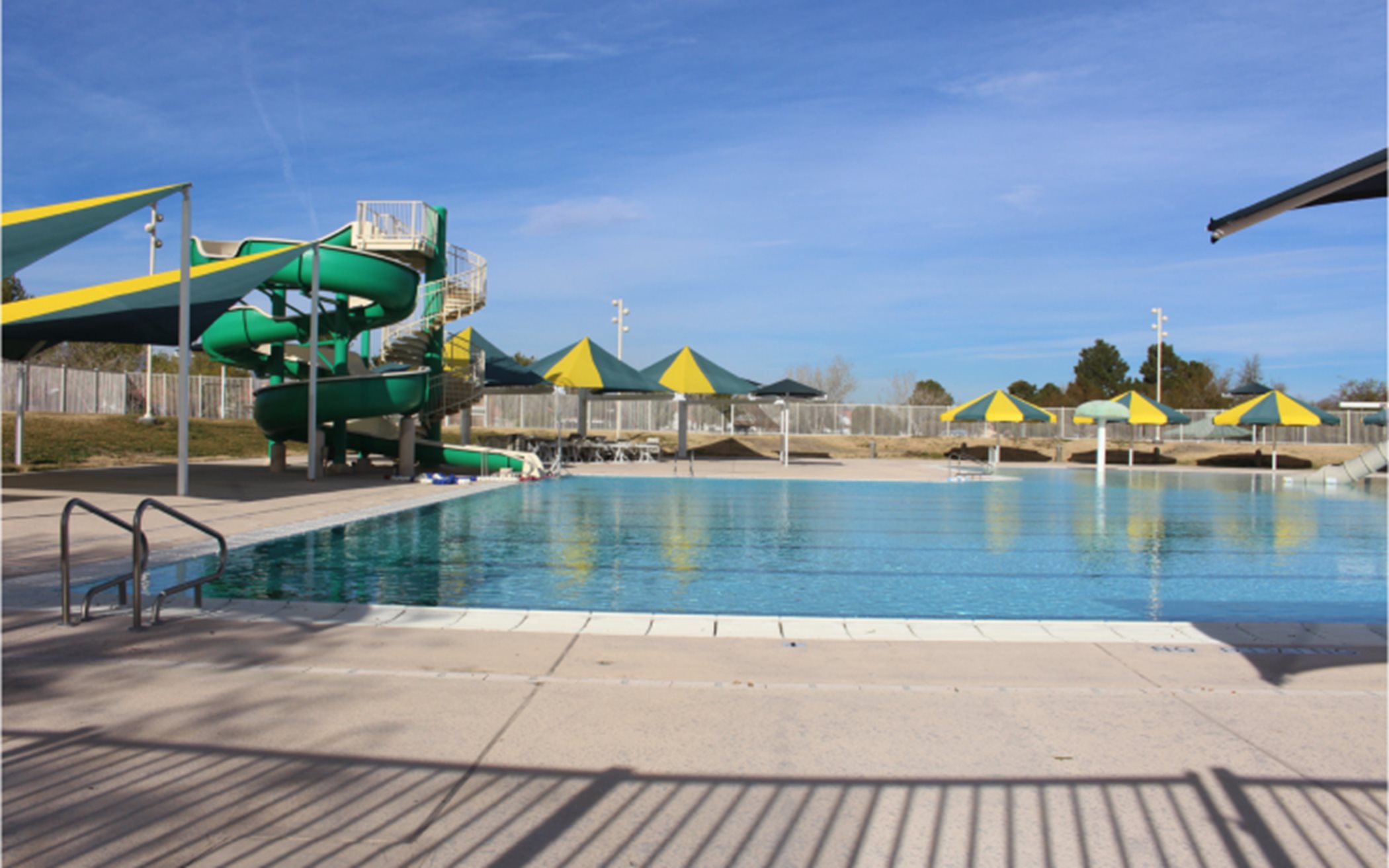Valley Vista swimming pool features lap lanes, covered tables and a fun waterslide