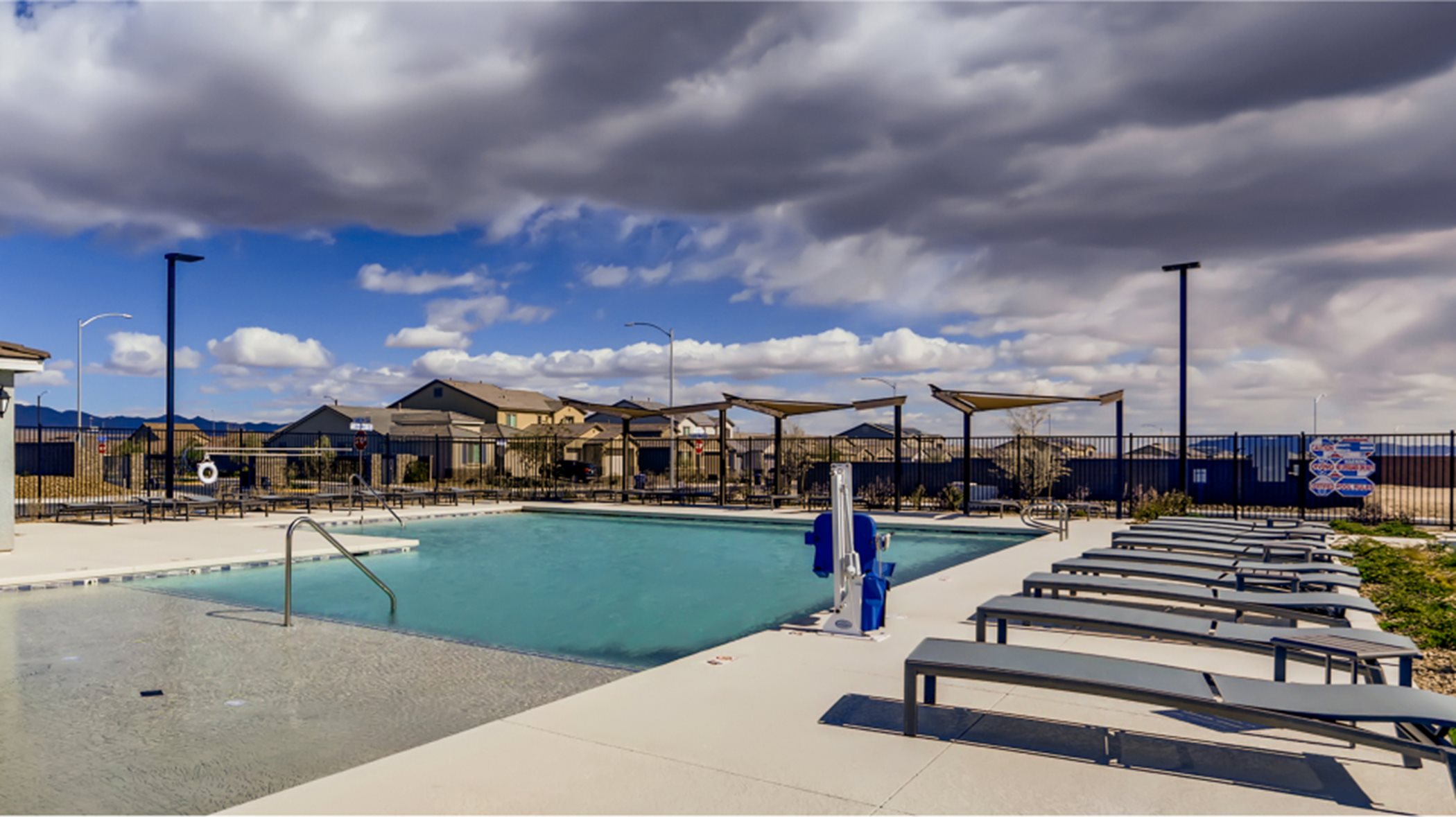 Stone Creek swimming pool features lounge chairs