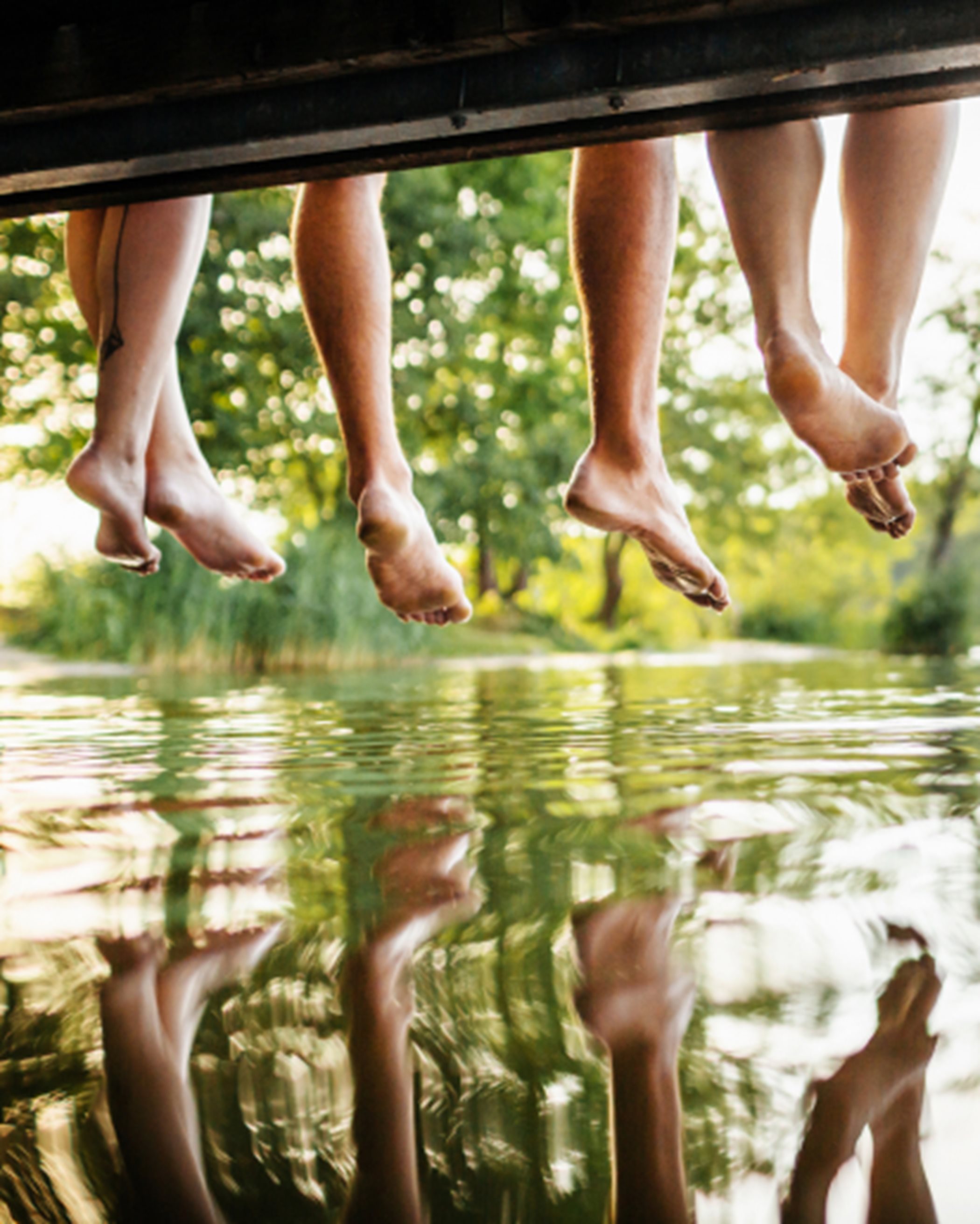 Feet hanging over a dock