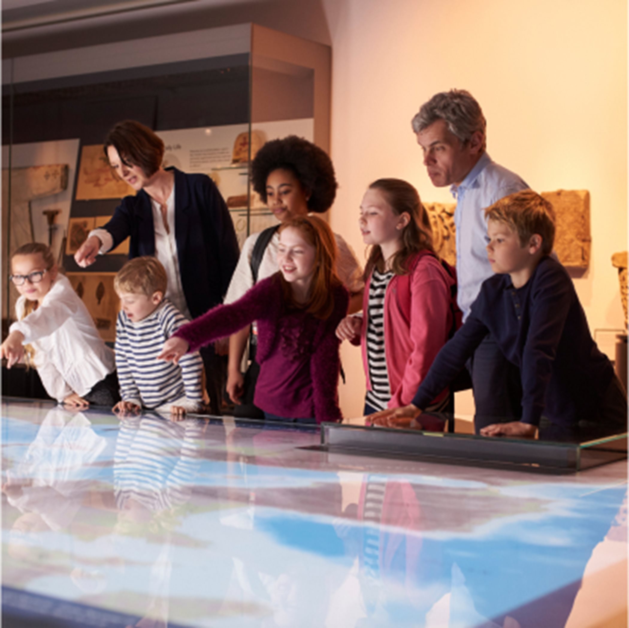 Families interacting with a museum display