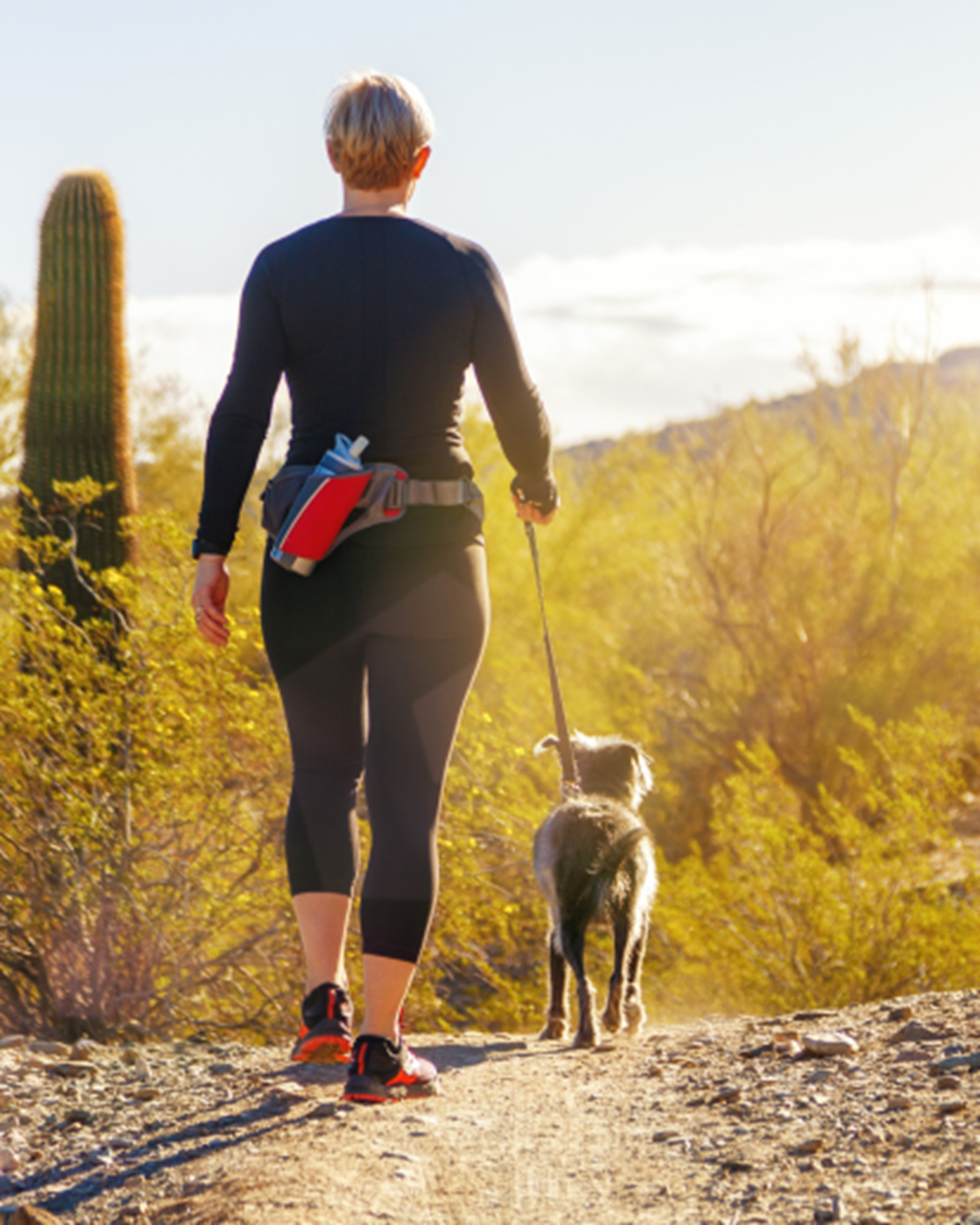Woman and dog hiking