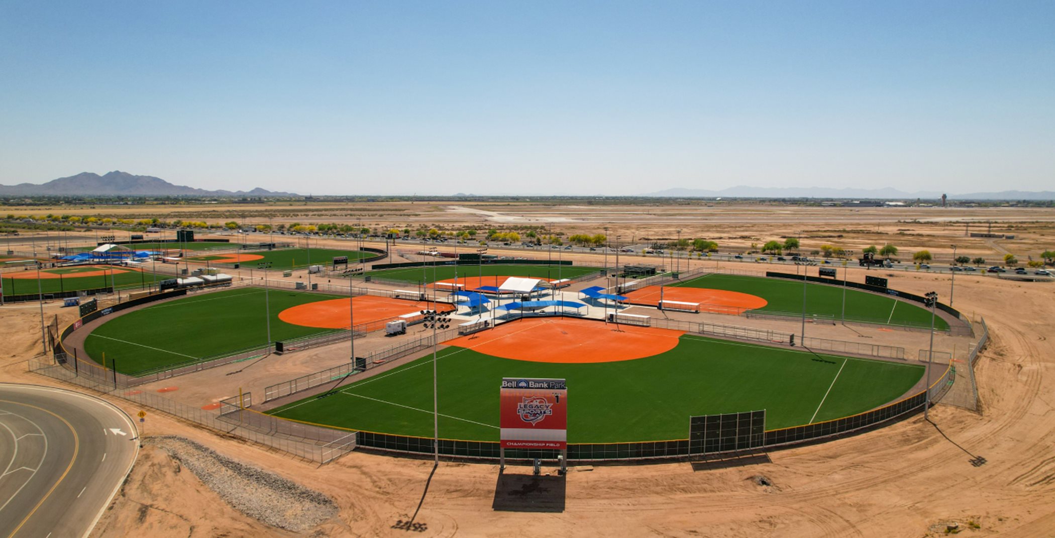 A circular field containing three baseball diamonds