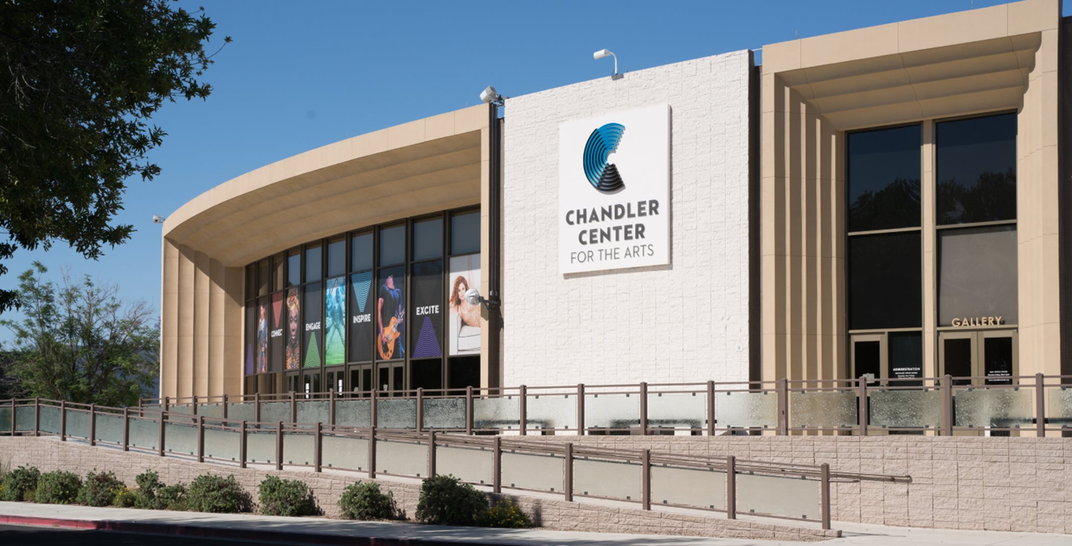Entrance to the Chandler Center for the Arts, which is a long, rounded building with large glass windows.
