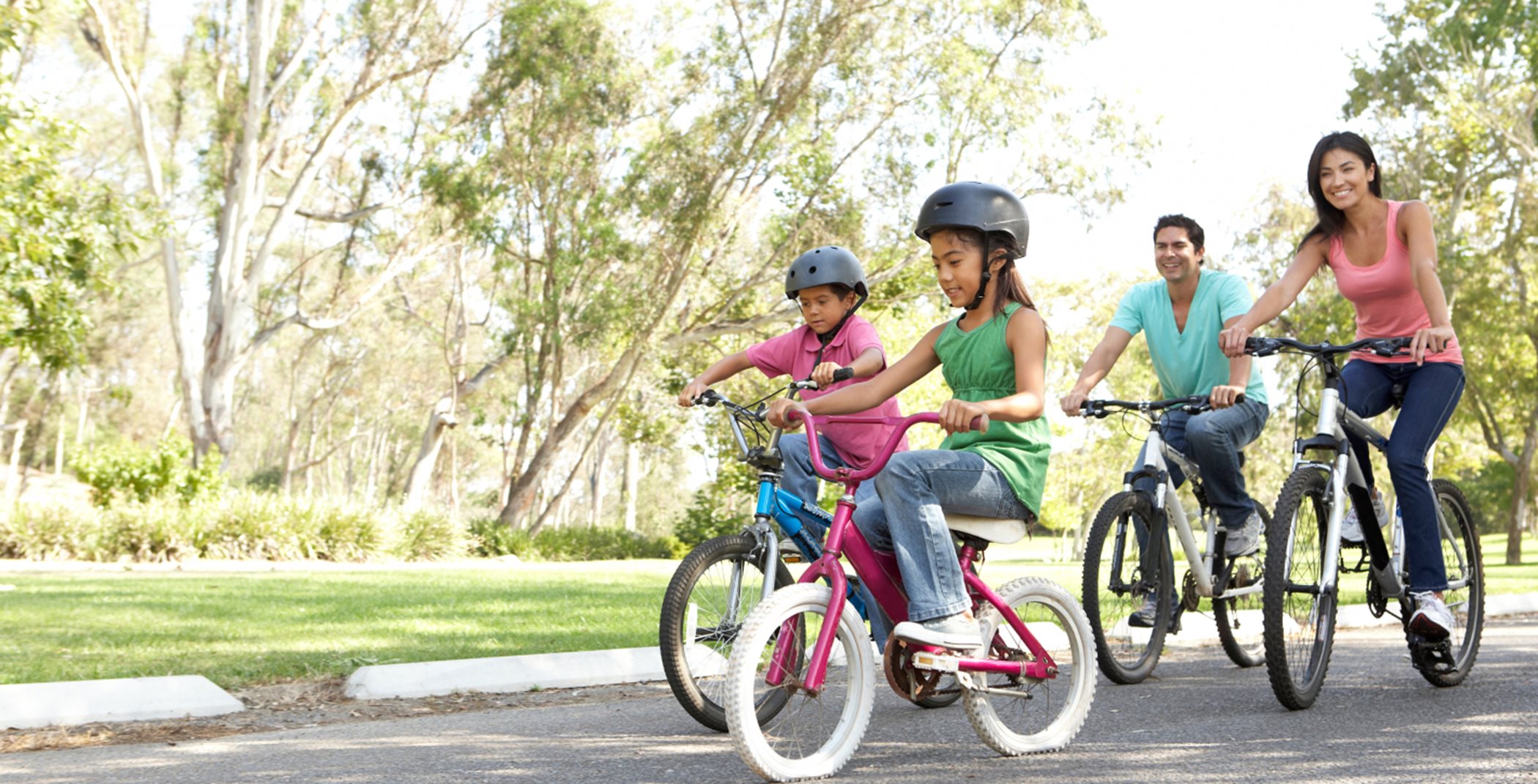 A family riding their bikes together