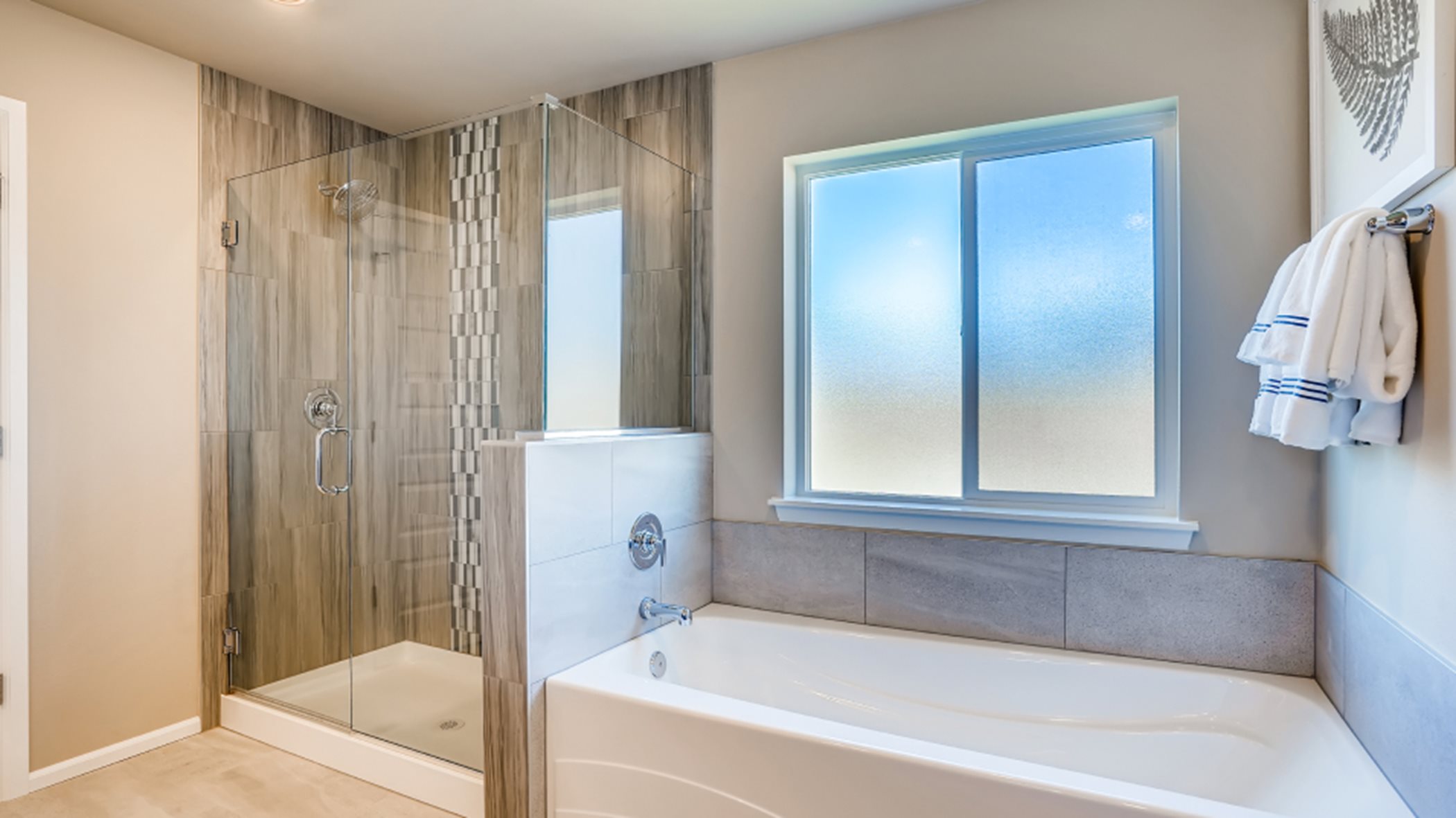 Separate tub and shower in the en-suite bathroom