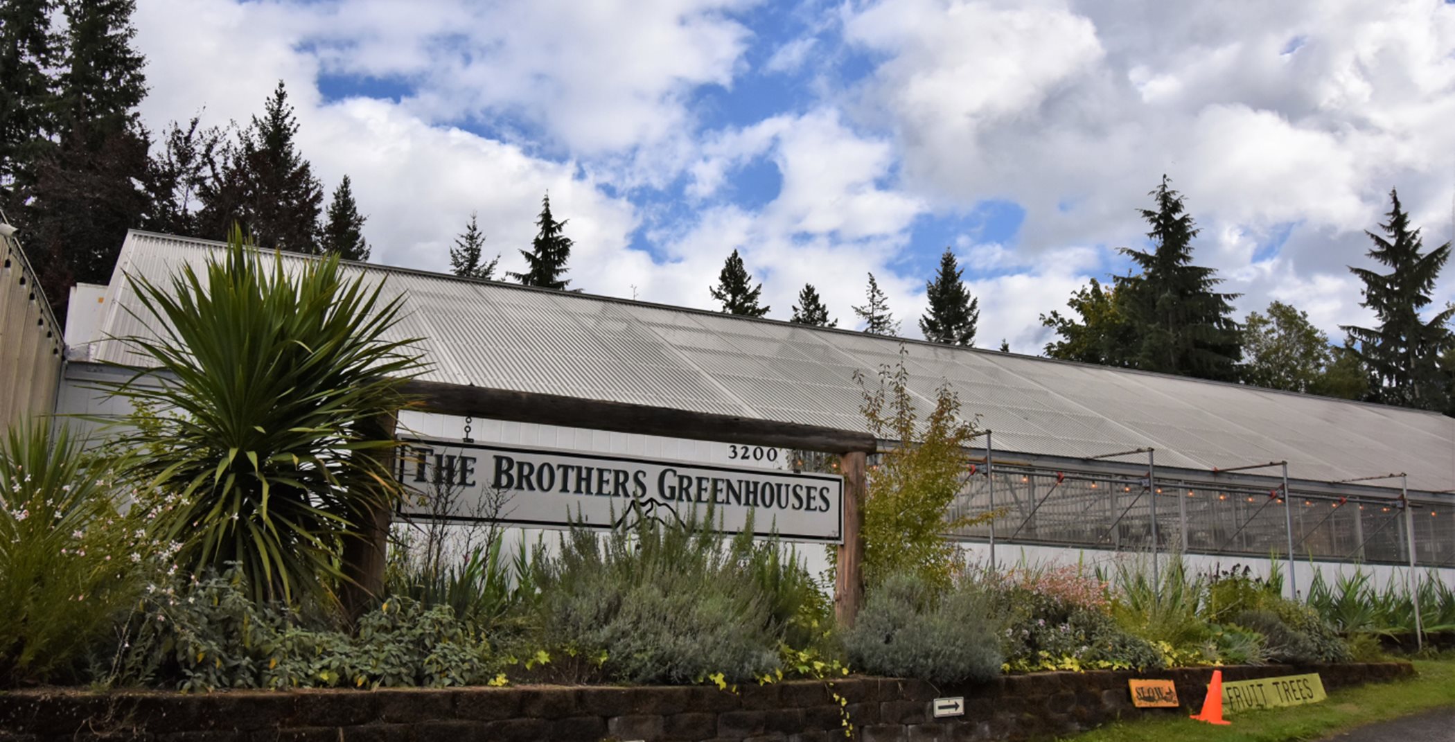 Sign on the side of the Brothers Greenhouse structure