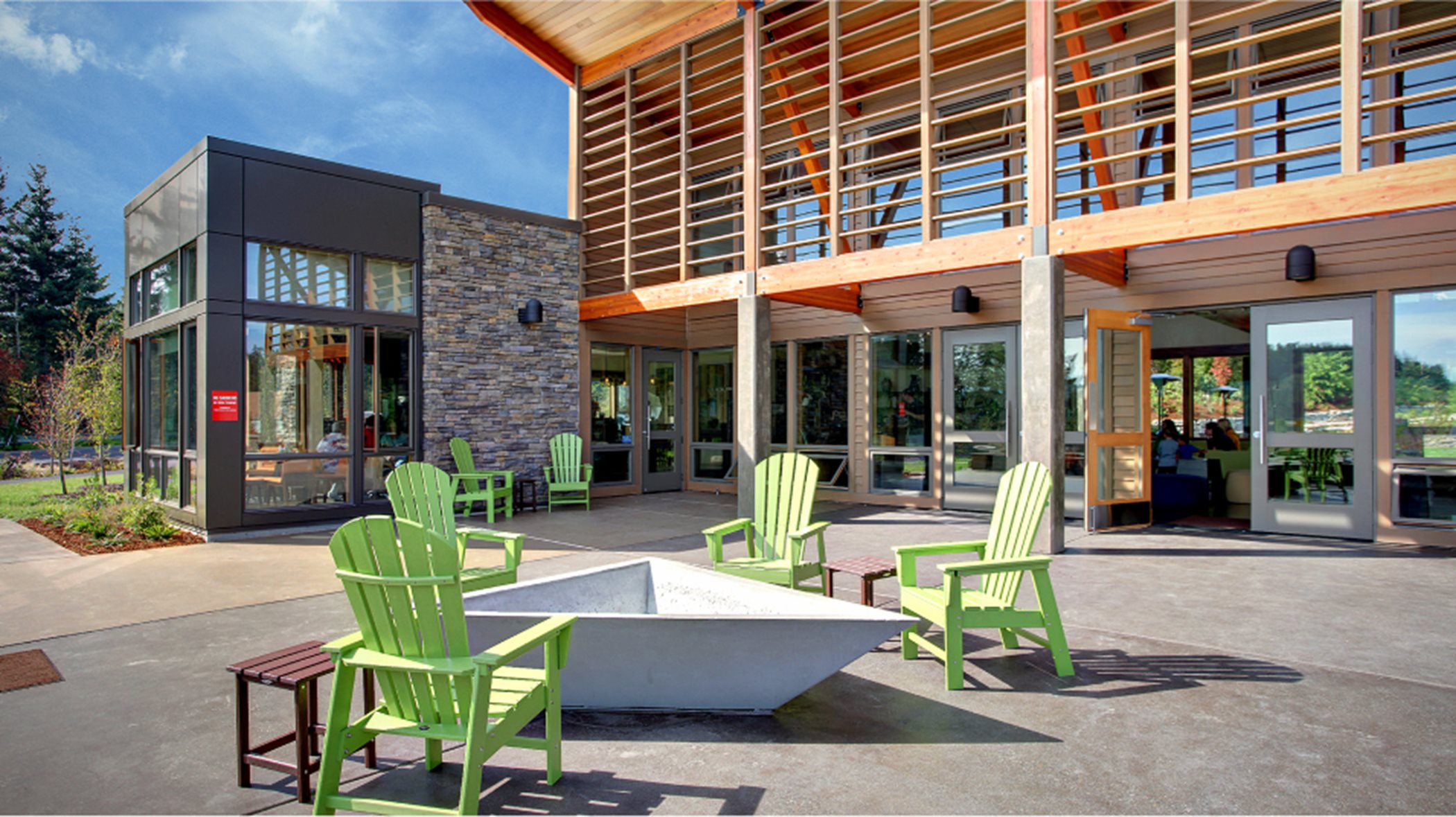 Community center exterior with outdoor seating