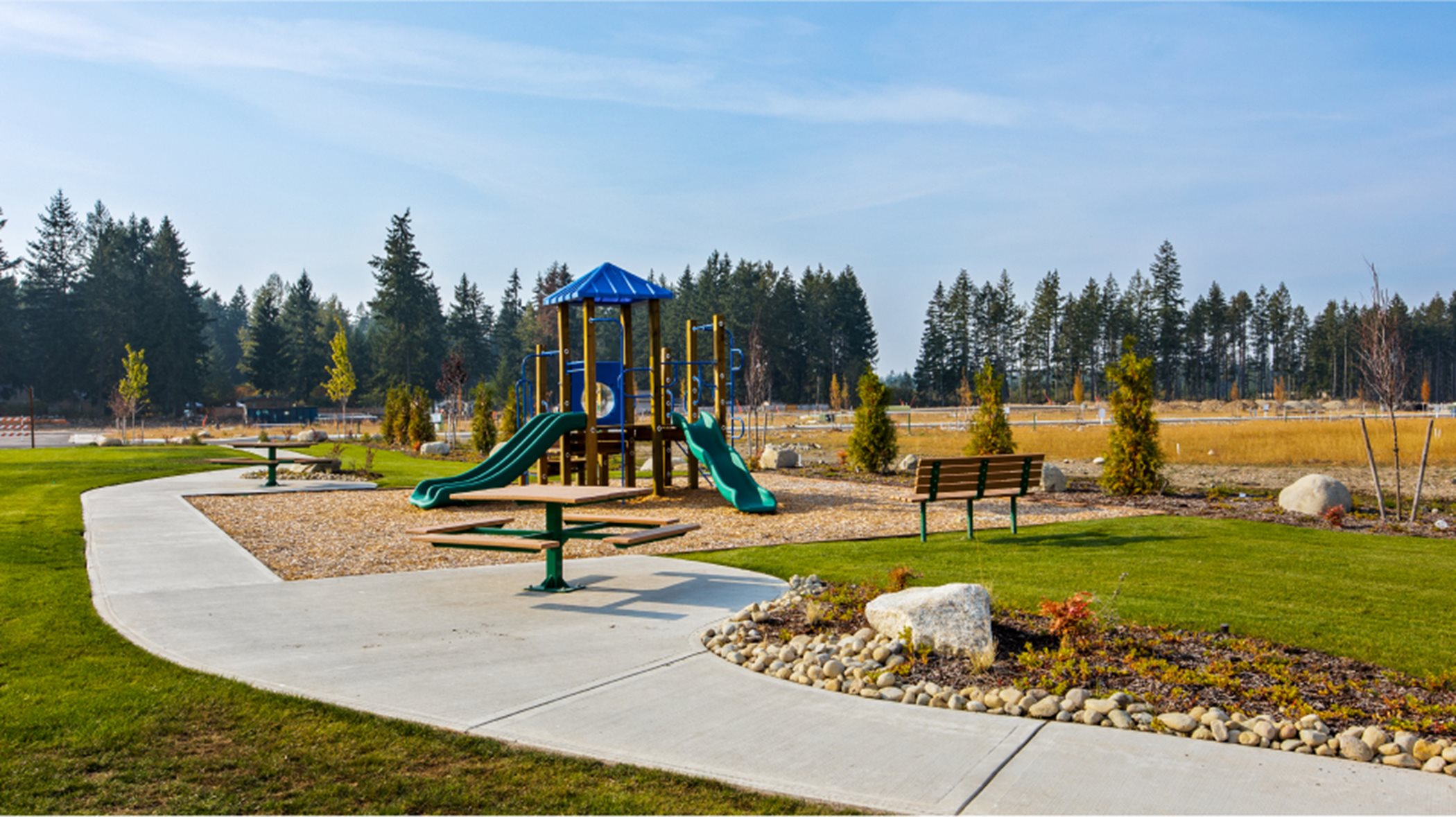 Community park with grass and play apparatus