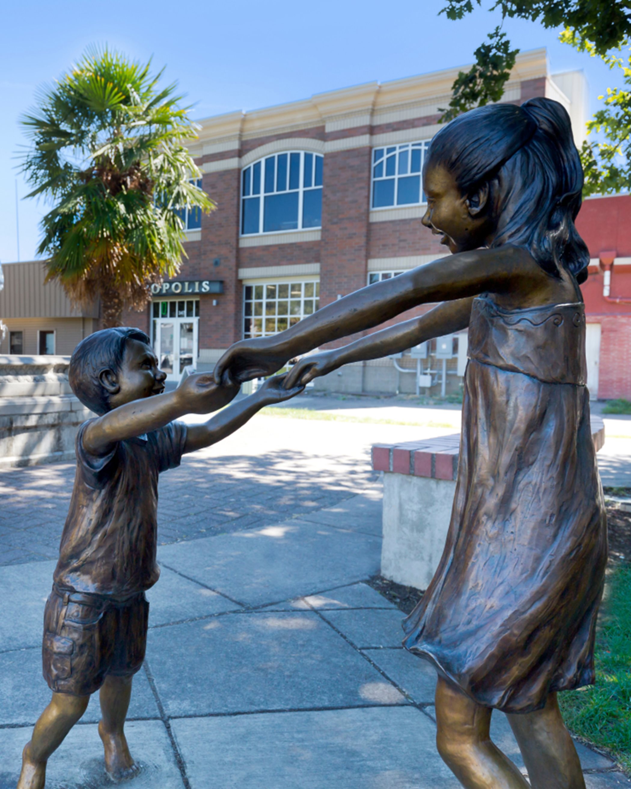 A Woodburn statue of two children