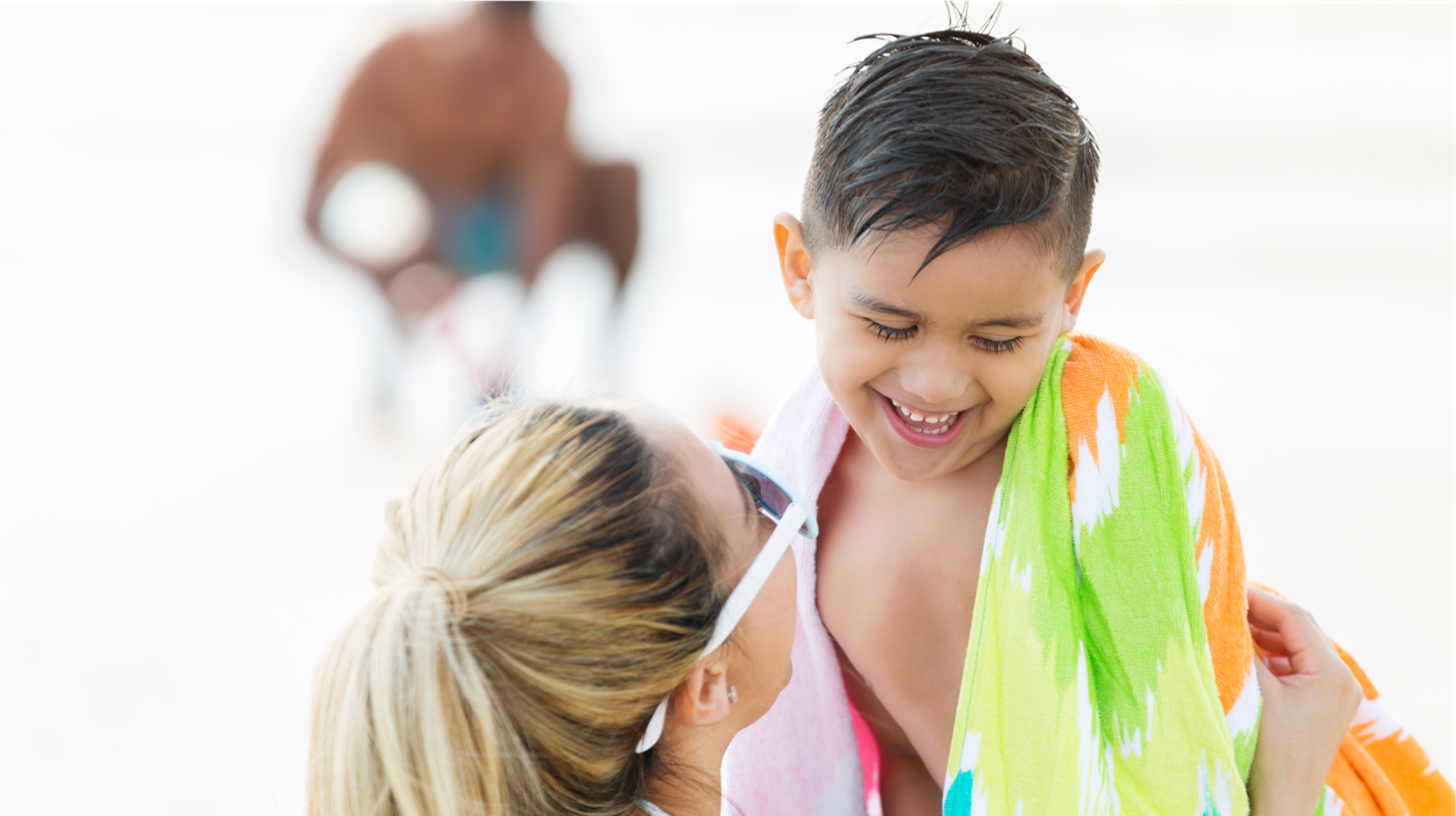 stock image of woman and child with pool towel