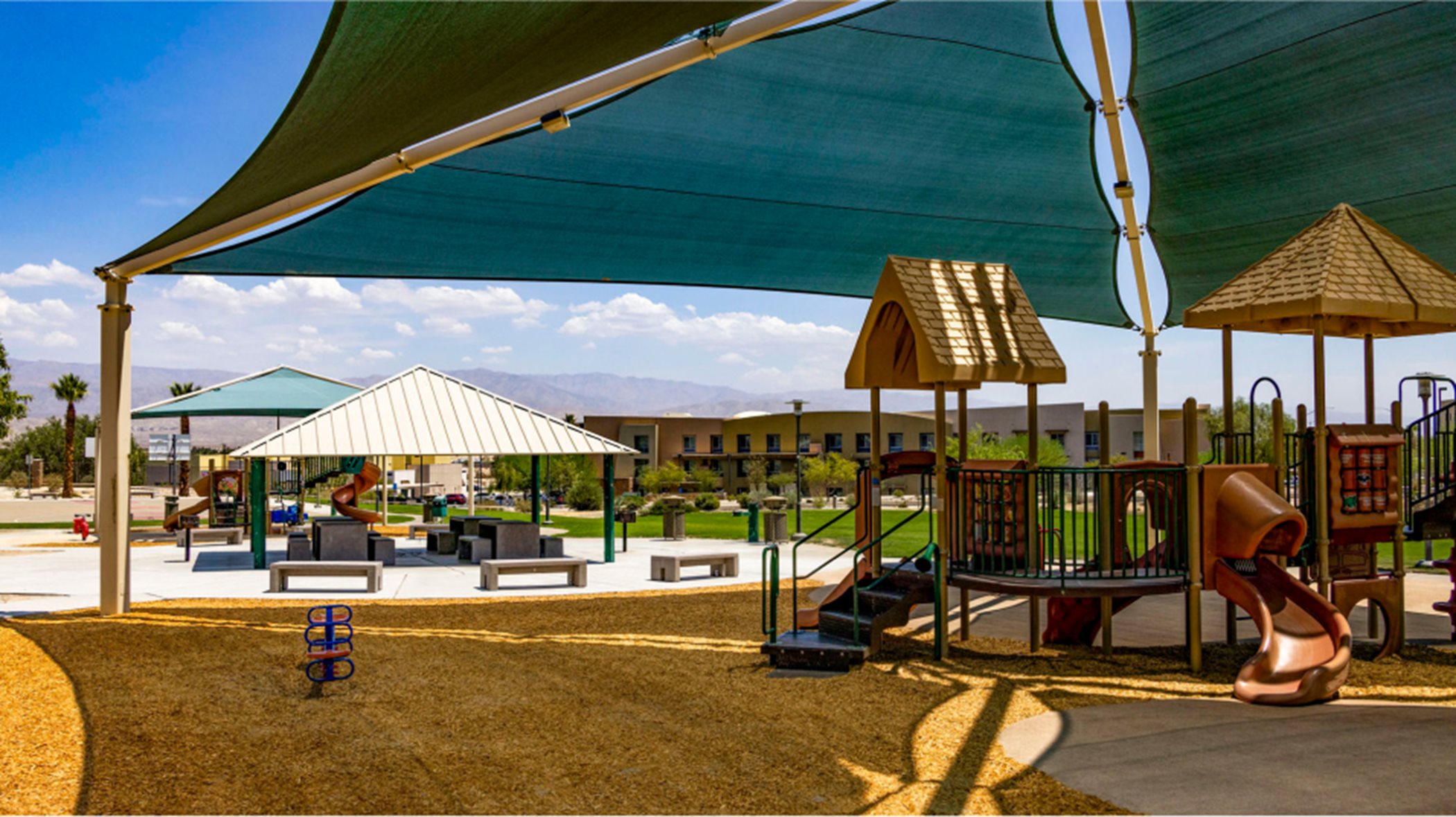 shaded playground with picnic available