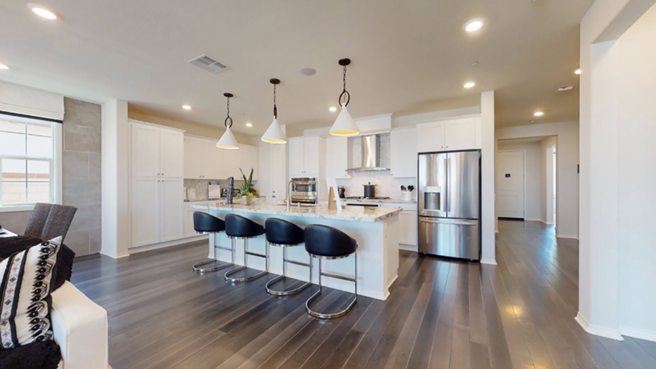 Kitchen with center island, appliances, and ample cabinetry