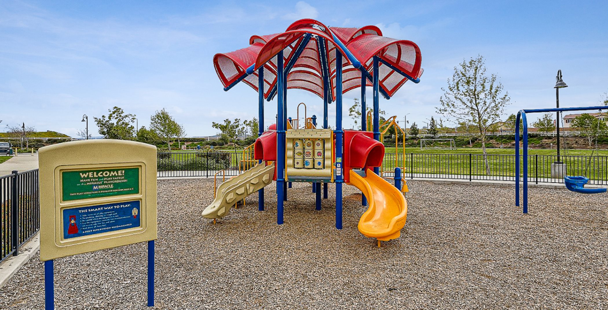 Playset at the park with two slides