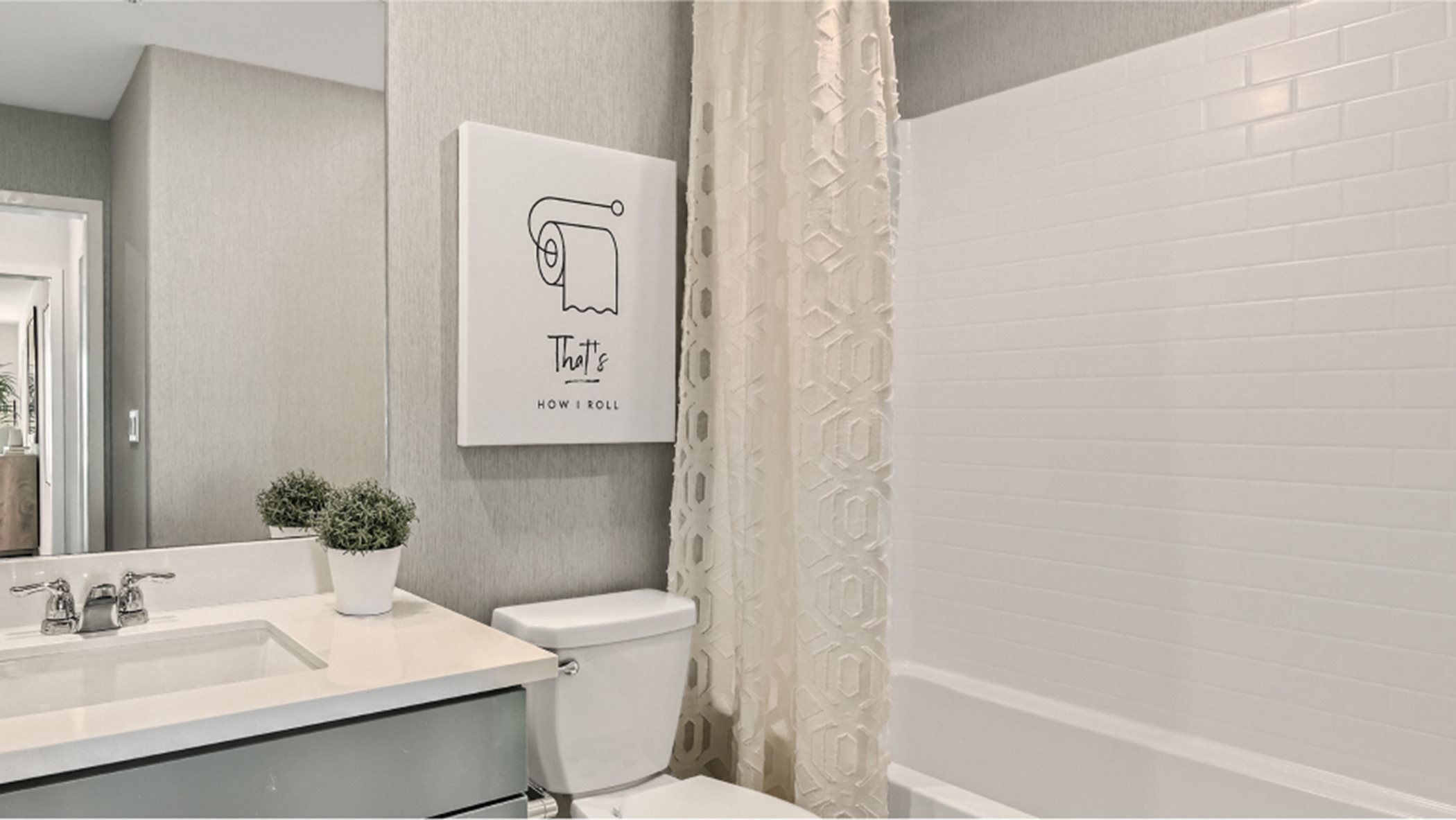Furnished Bathroom image with combined shower-tub
