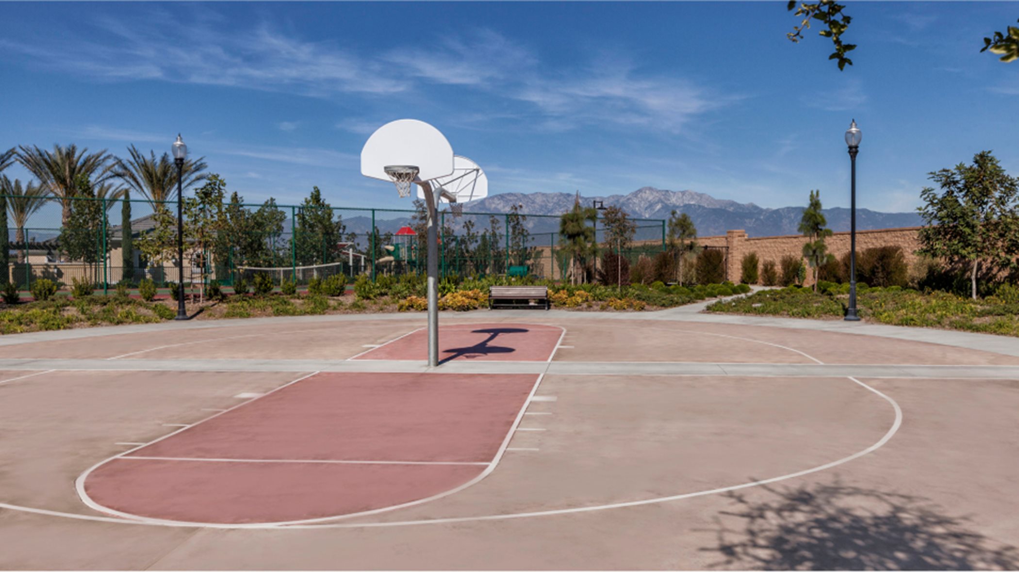basketball court in the daylight with a focus on the court