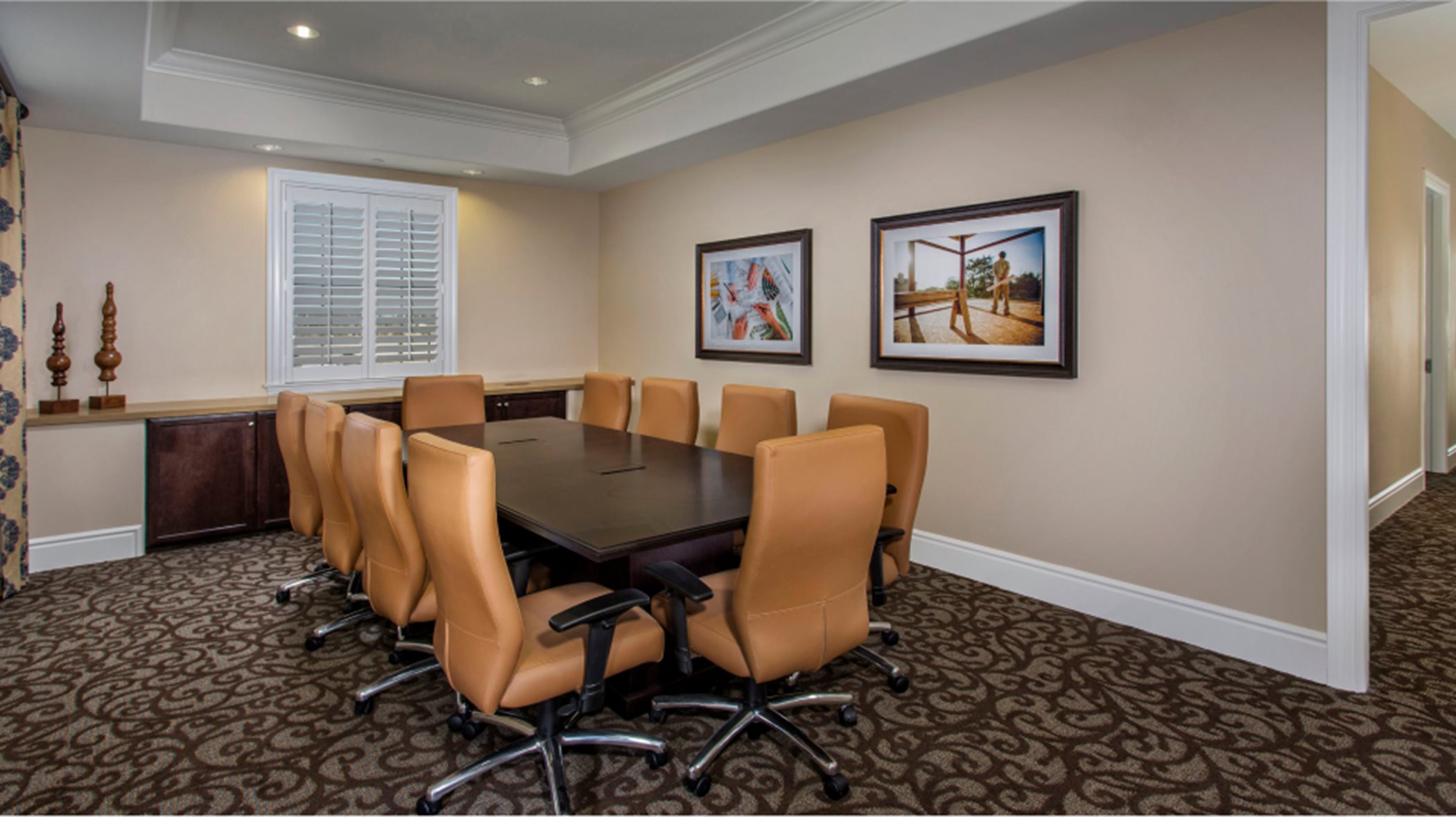 Conference room with a long table and swivel chairs