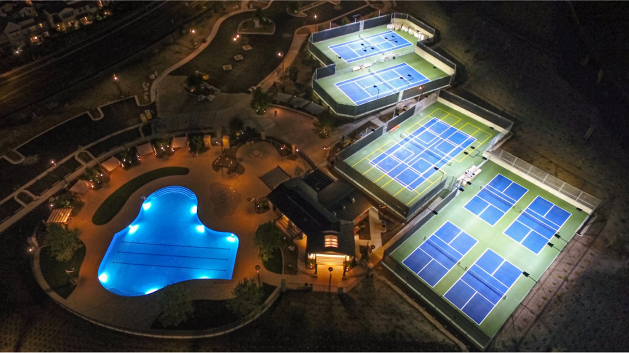 Aerial of Tennis courts and pool at Escencia sports park
