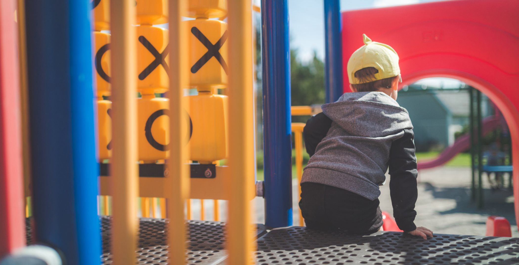Boy playing on play structure
