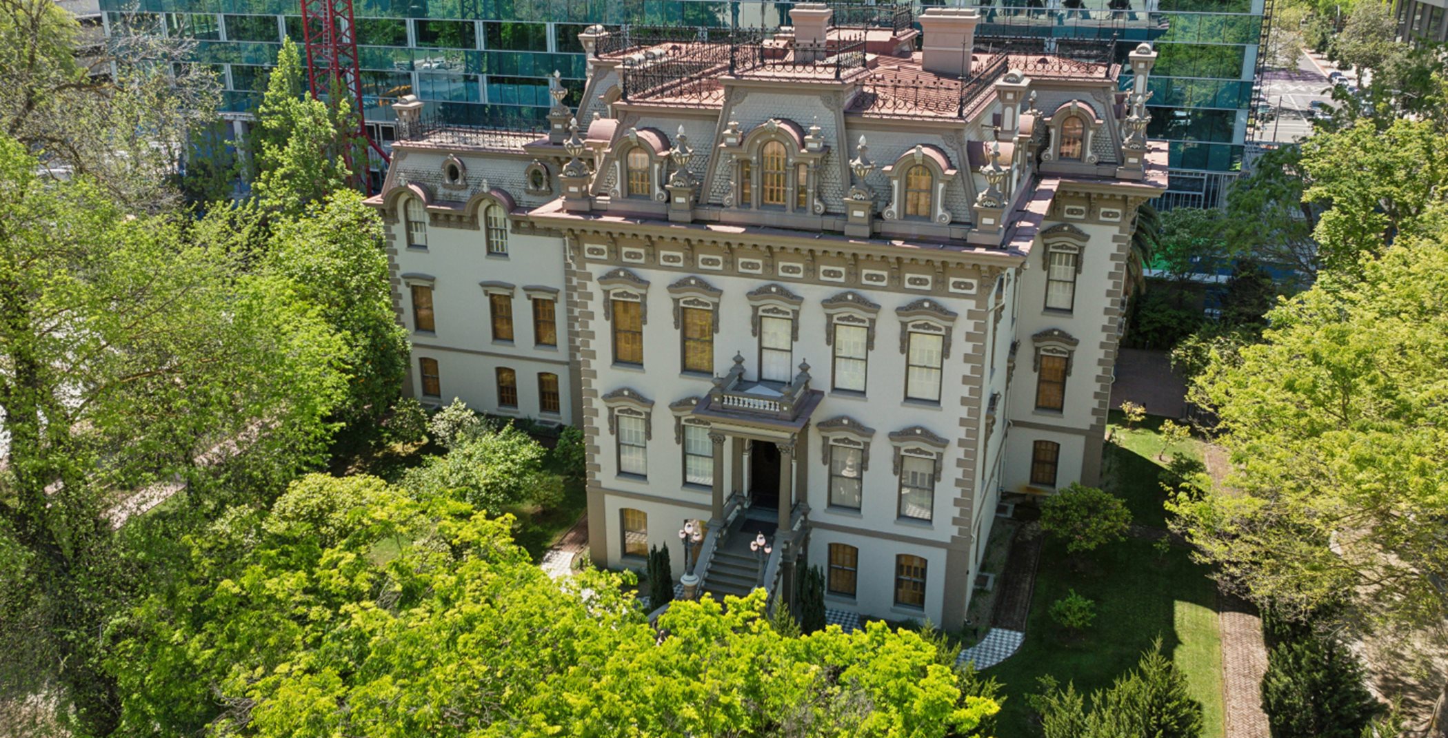 Aerial view of Leland Stanford Mansion surrounded by trees