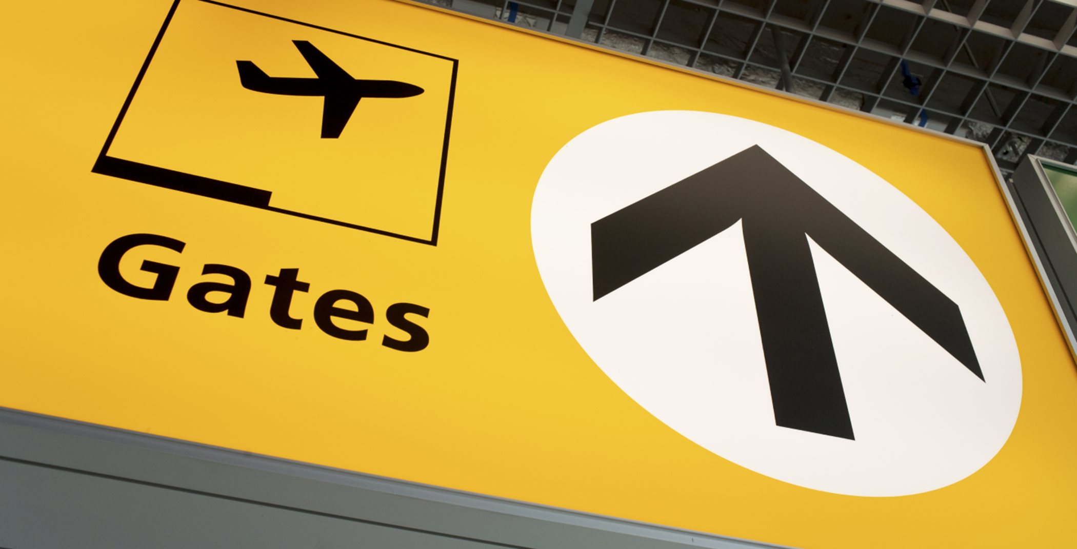 Yellow sign to gate at airport