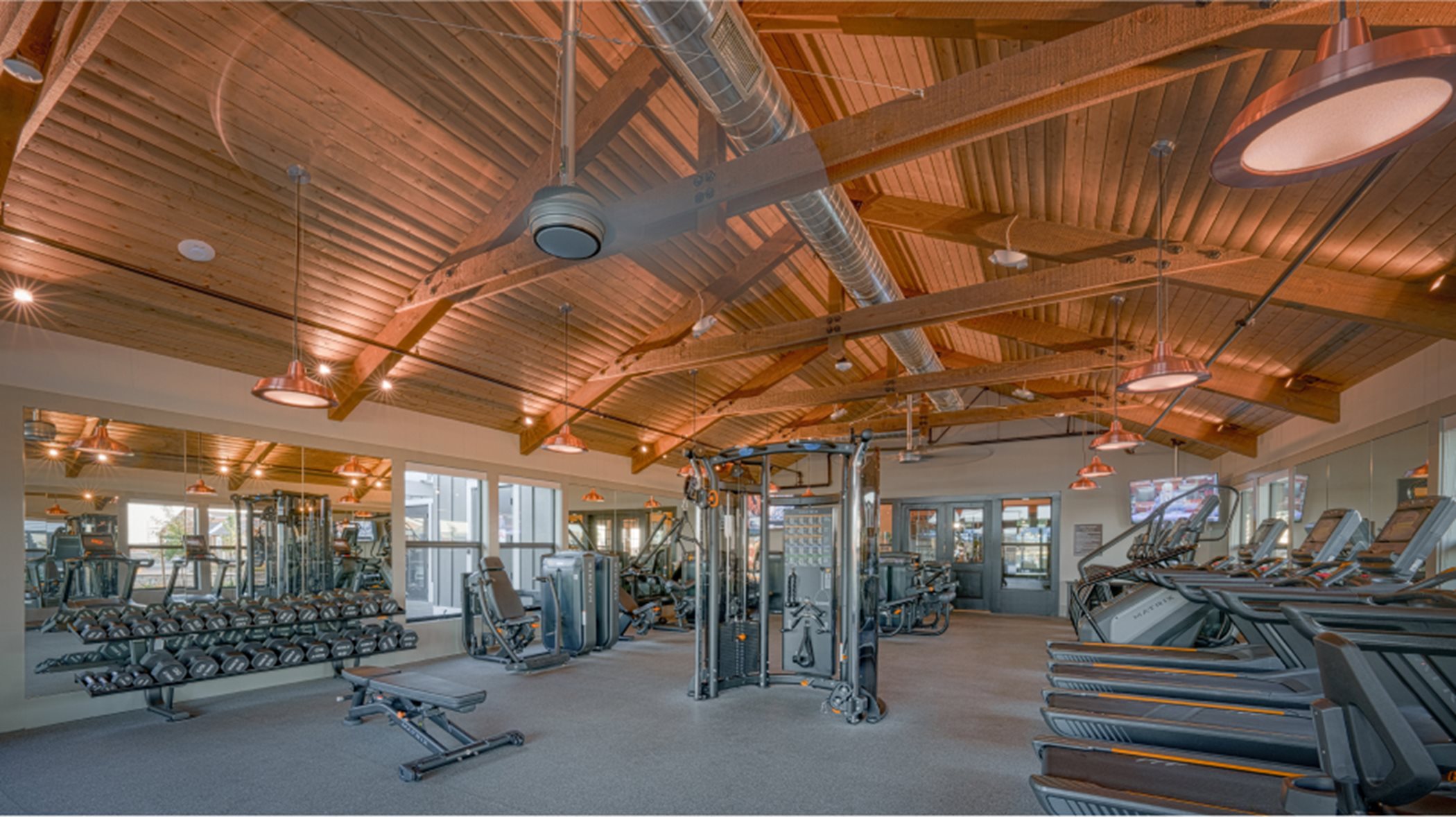 Fitness center interior with lots of machines