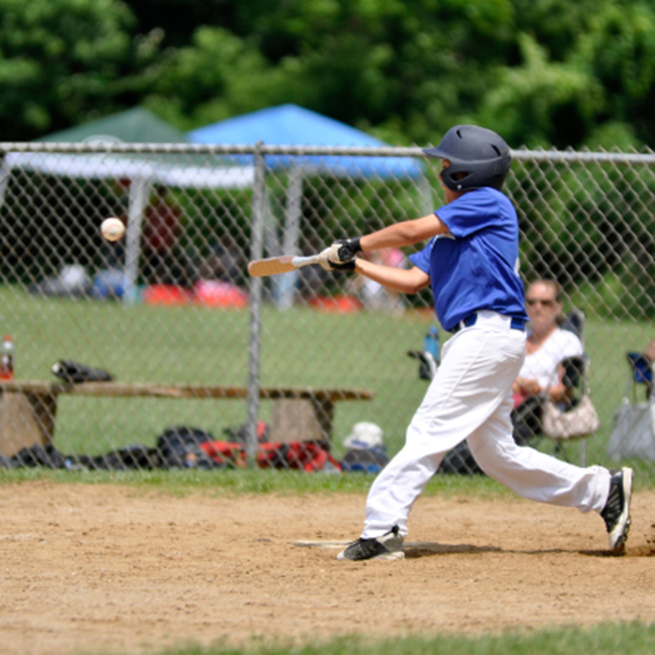 Boy swinging baseball at The Northern Lights Ball Fields