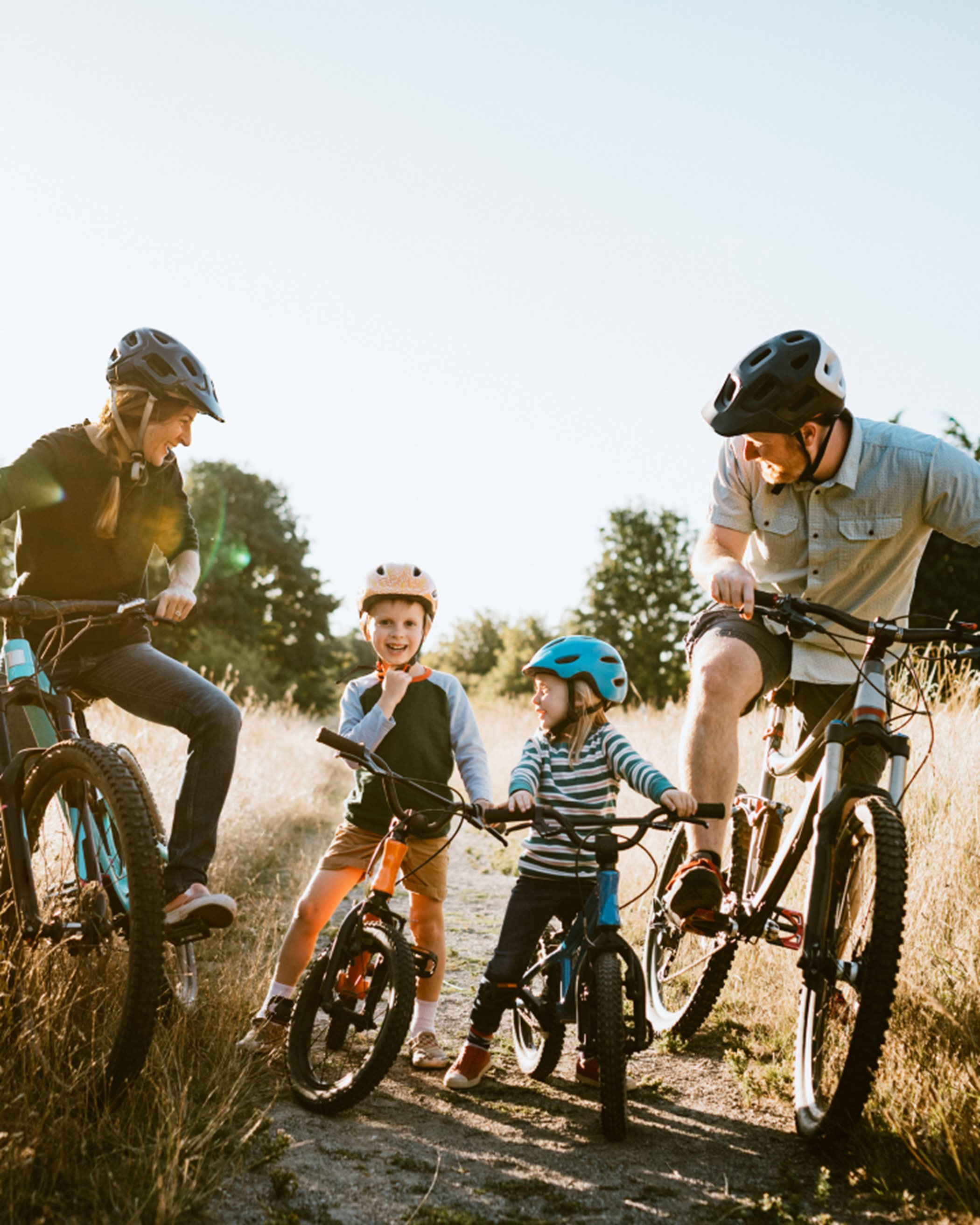 A family biking together on a trail