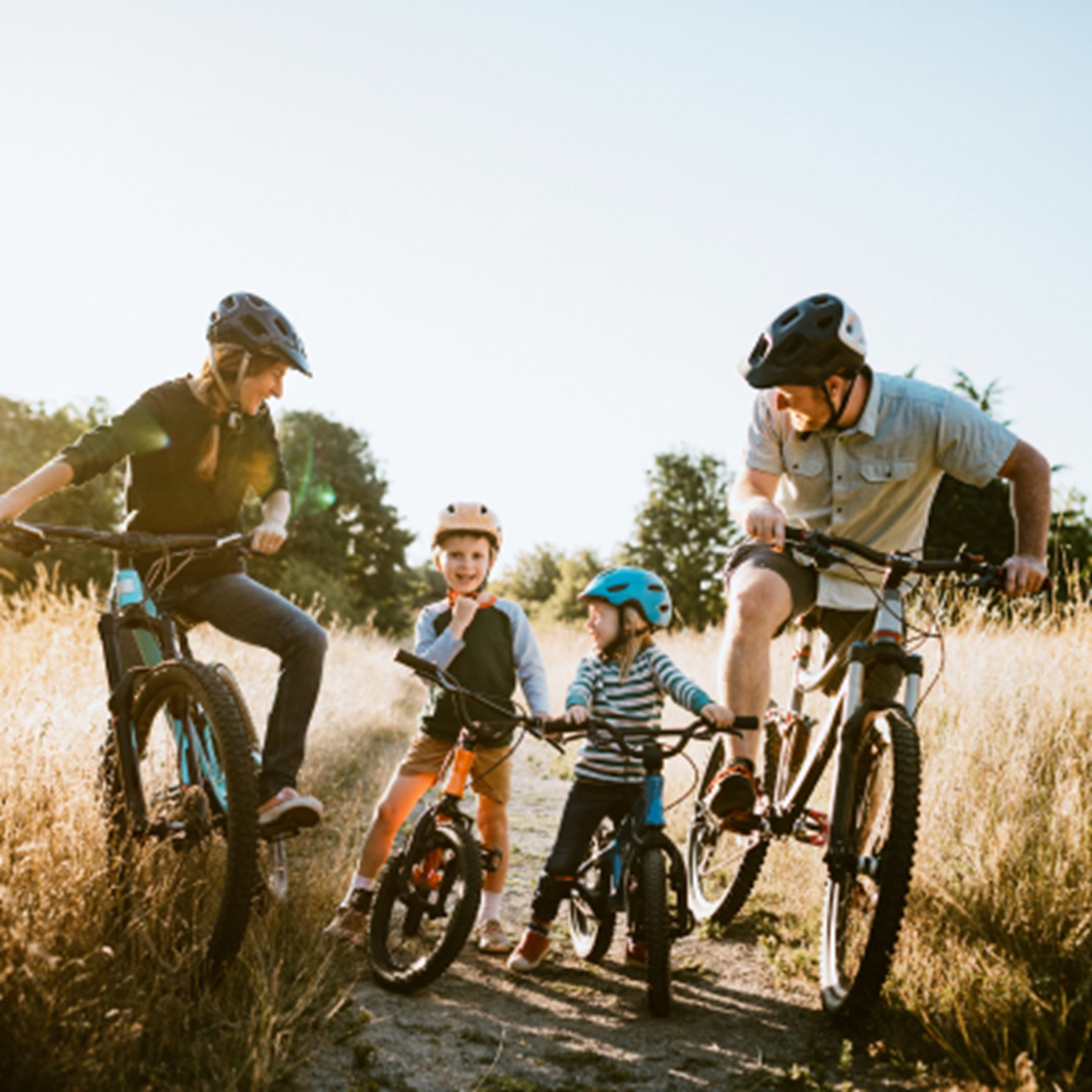 Family biking together on a trail