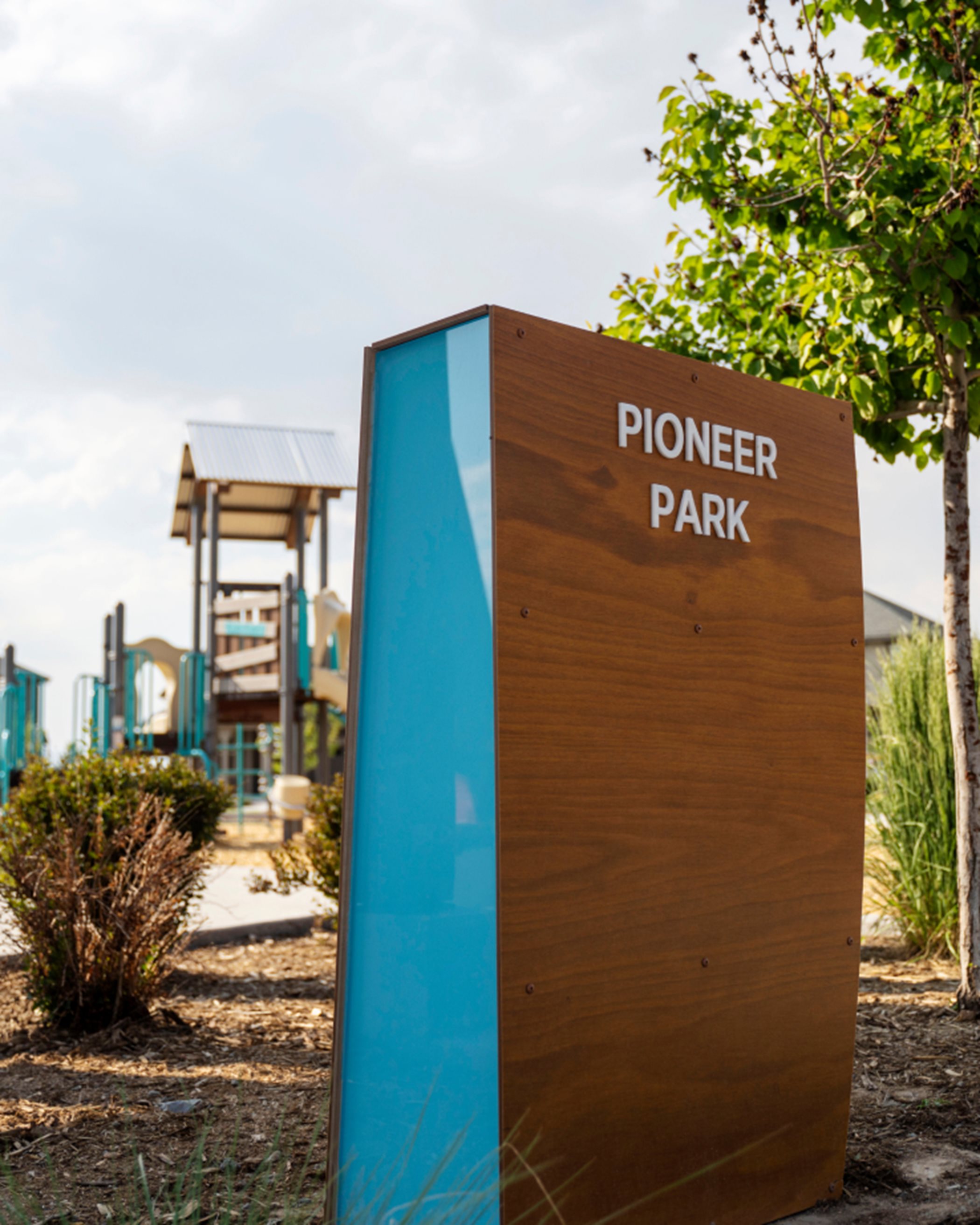 Pioneer Park playground and entrance sign