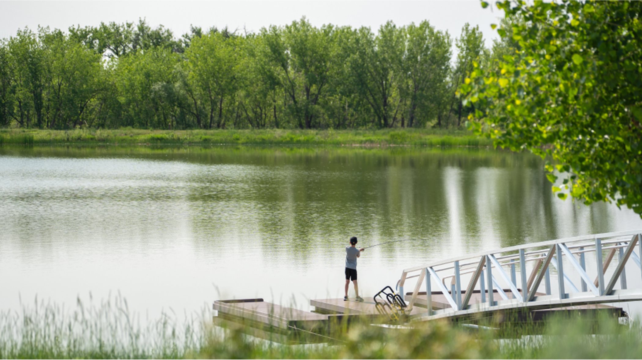Barefoot Lakes lake amenity boy fishing on lake