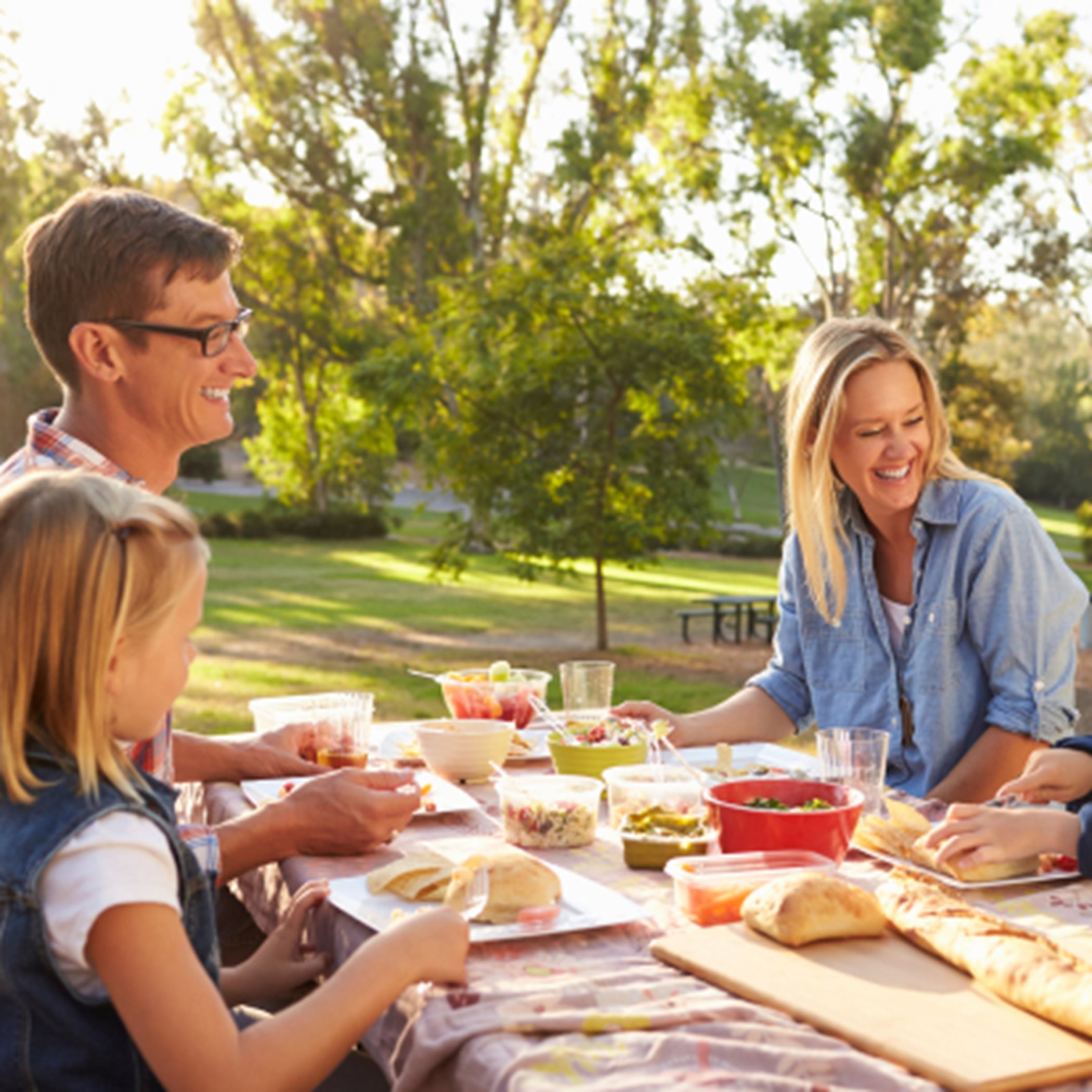Family enjoying a picnic in community together