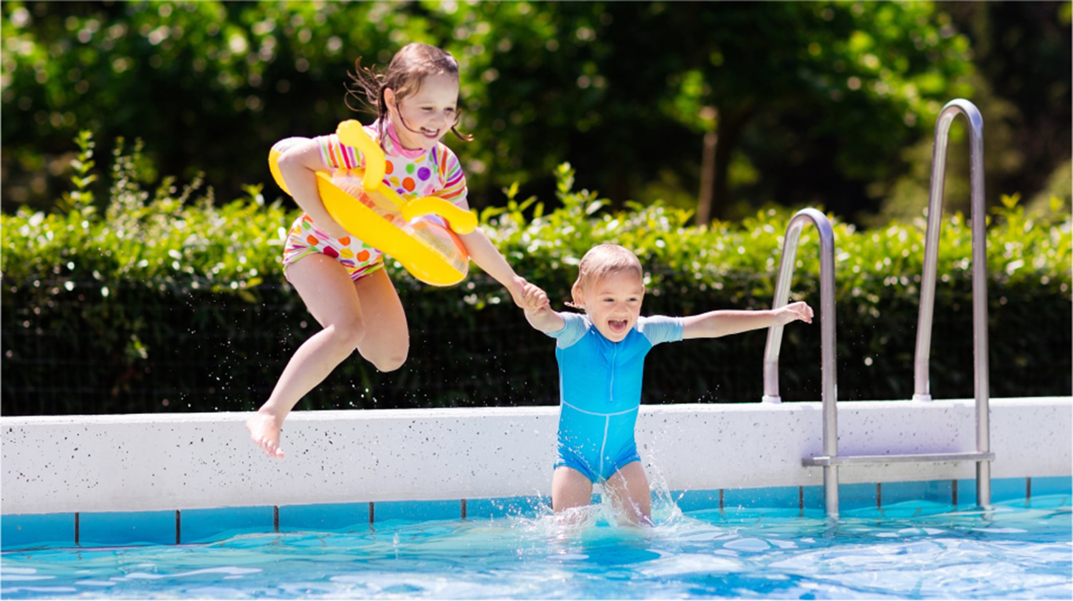 Kids jumping in swimming pool