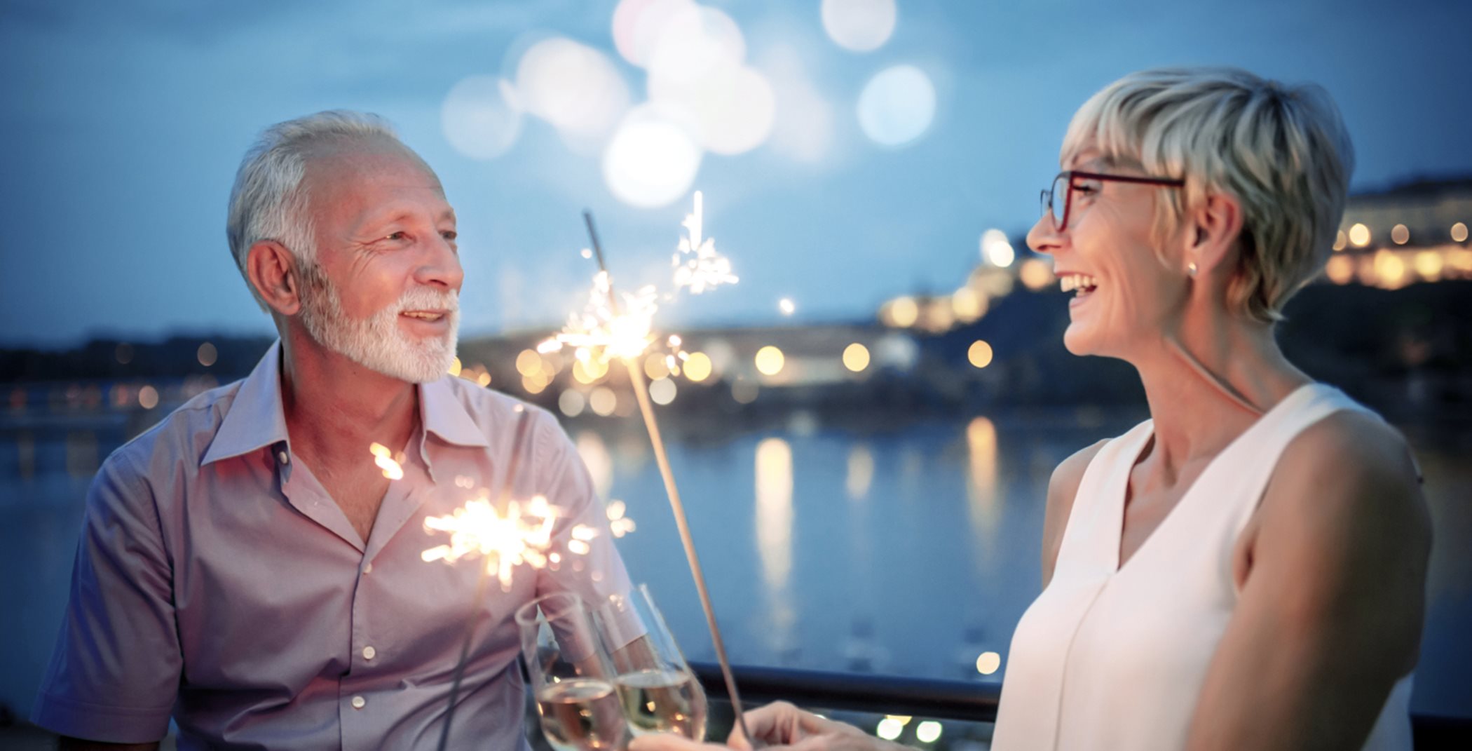 Active Adult Older Couple Celebrating with Sparklers