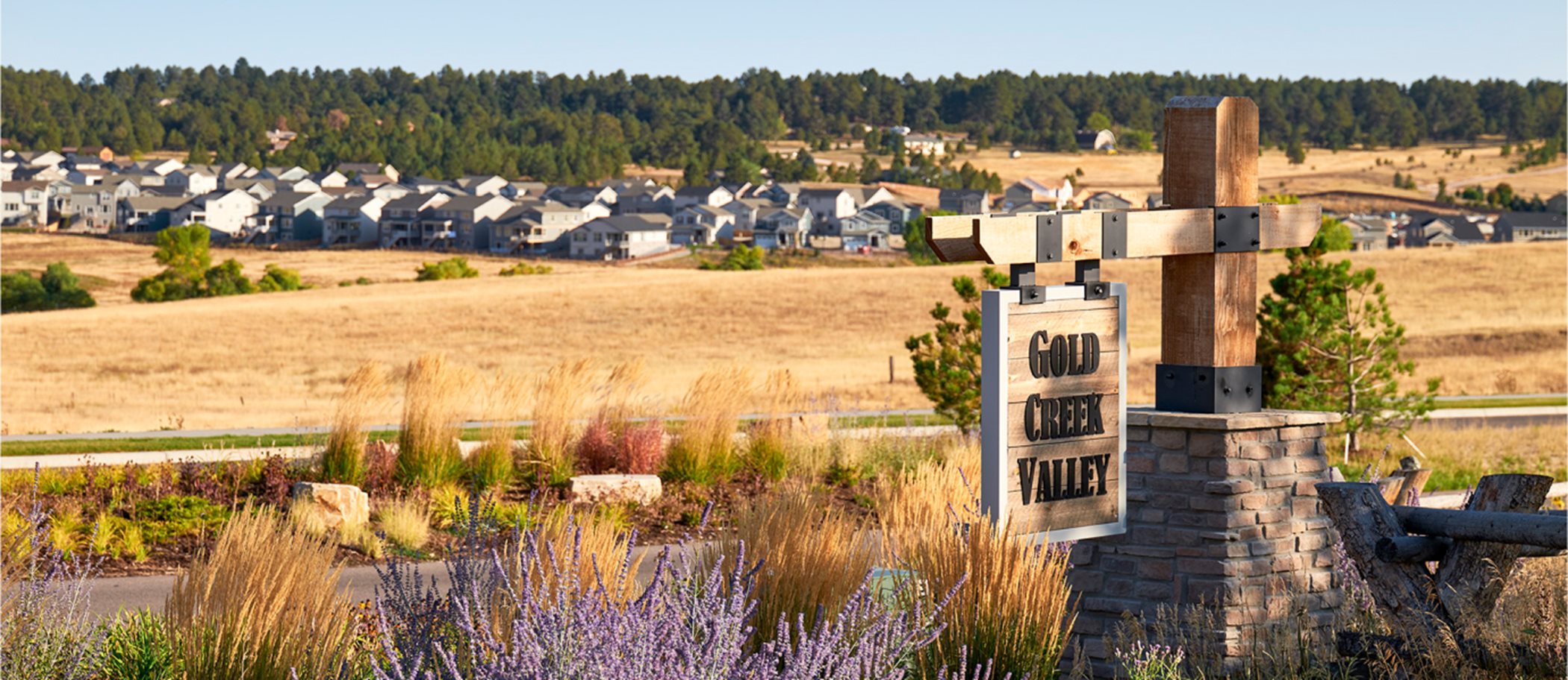 Gold Creek Valley sign with homes in background