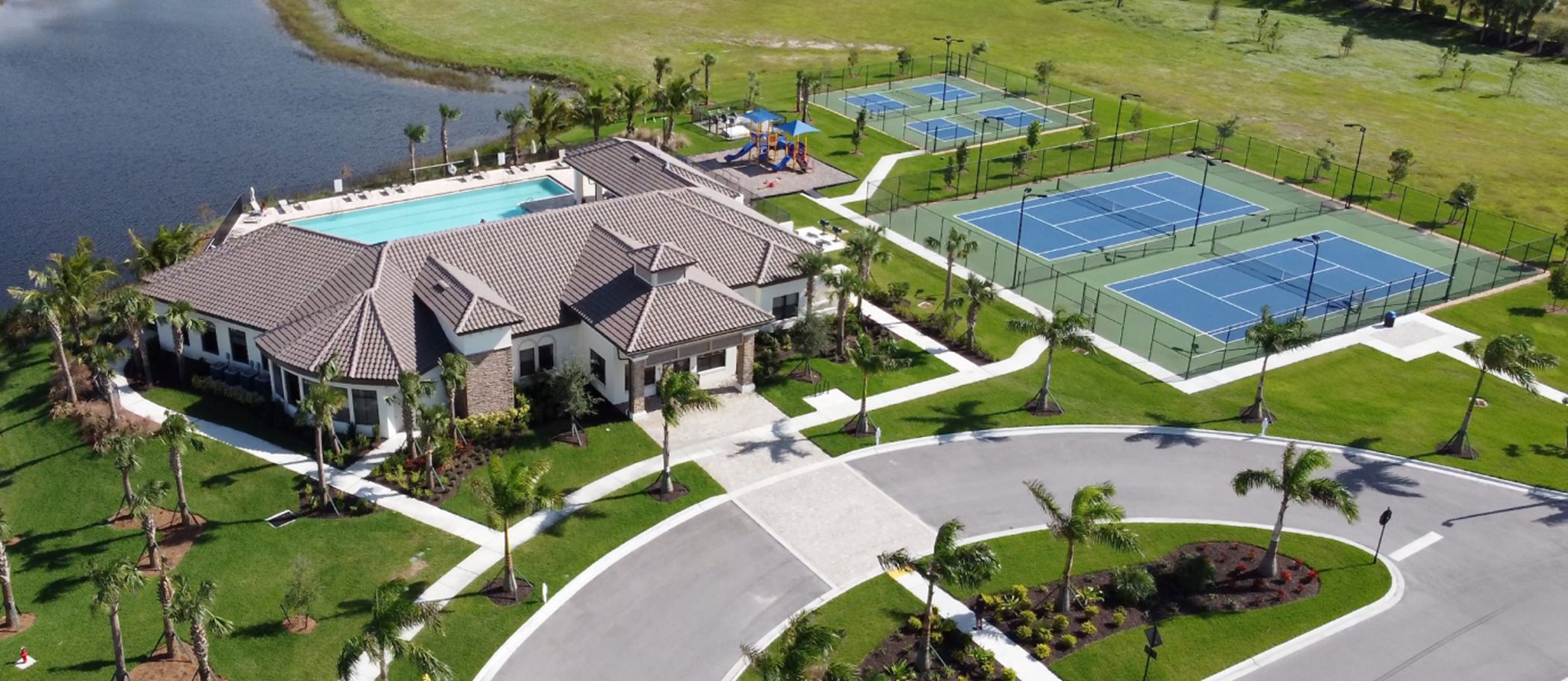 Aerial view of Portico's Clubhouse, Swimming Pool, and Tennis court