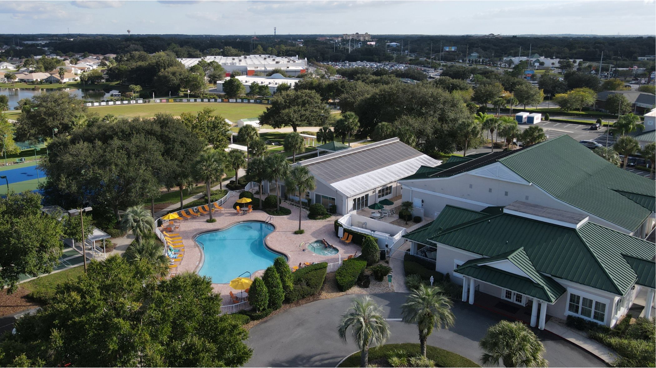 Drone shot of clubhouse pool and hot tub