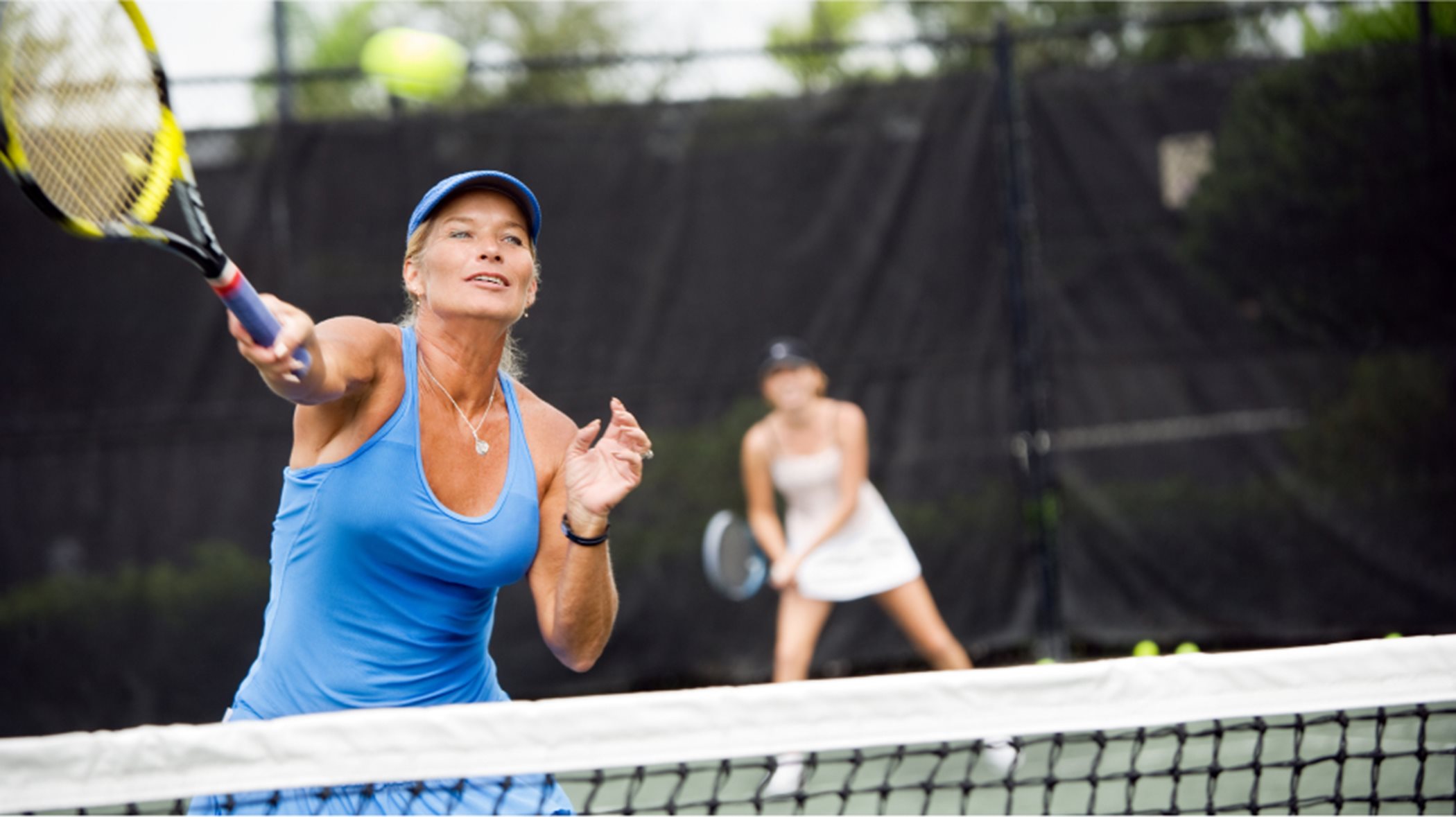 Woman hitting a tennis ball