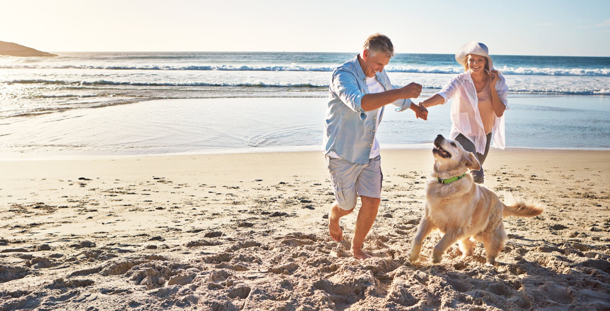 Couple with dog at beach