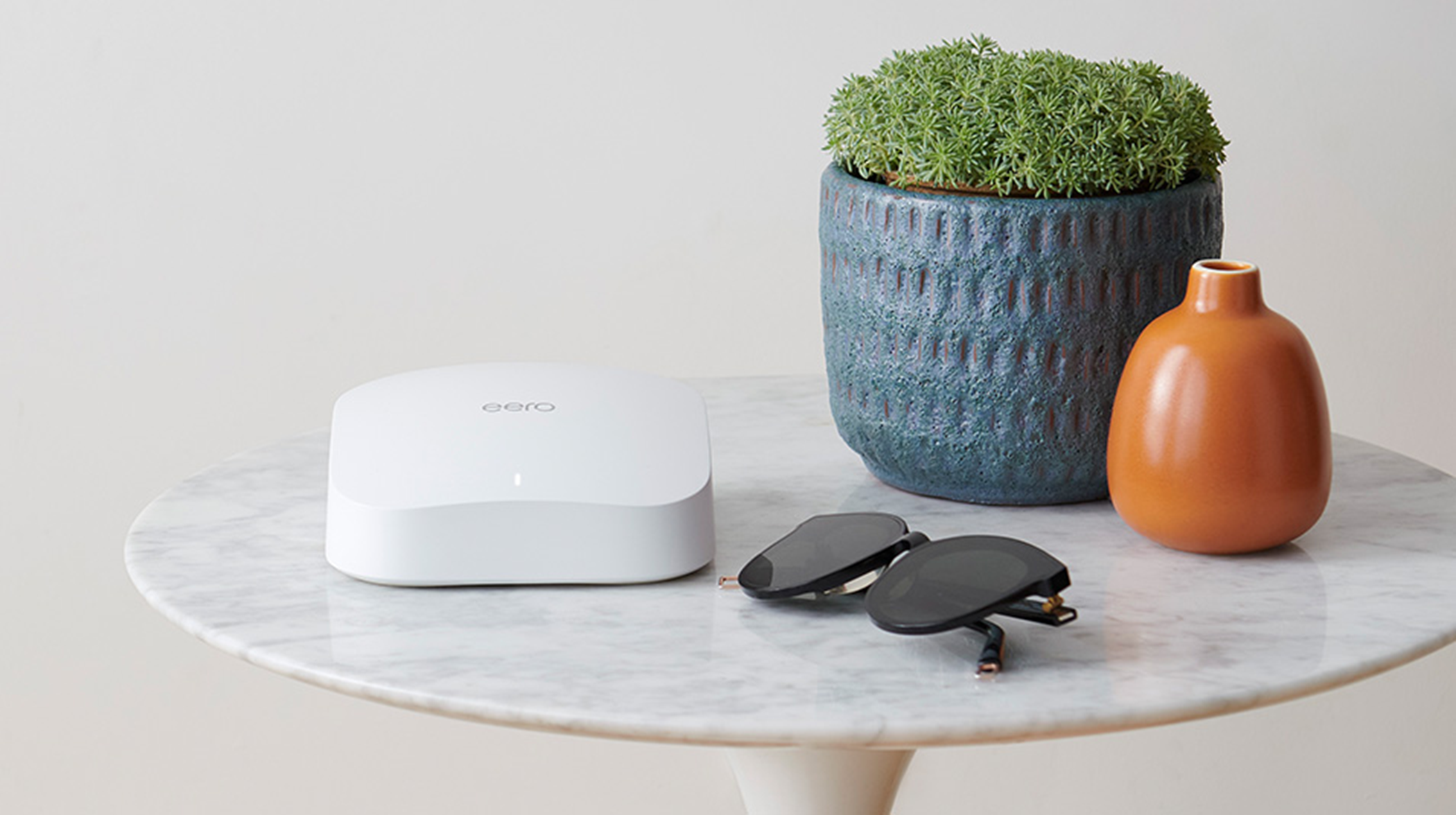 eero pro-mesh wifi system on a sidetable