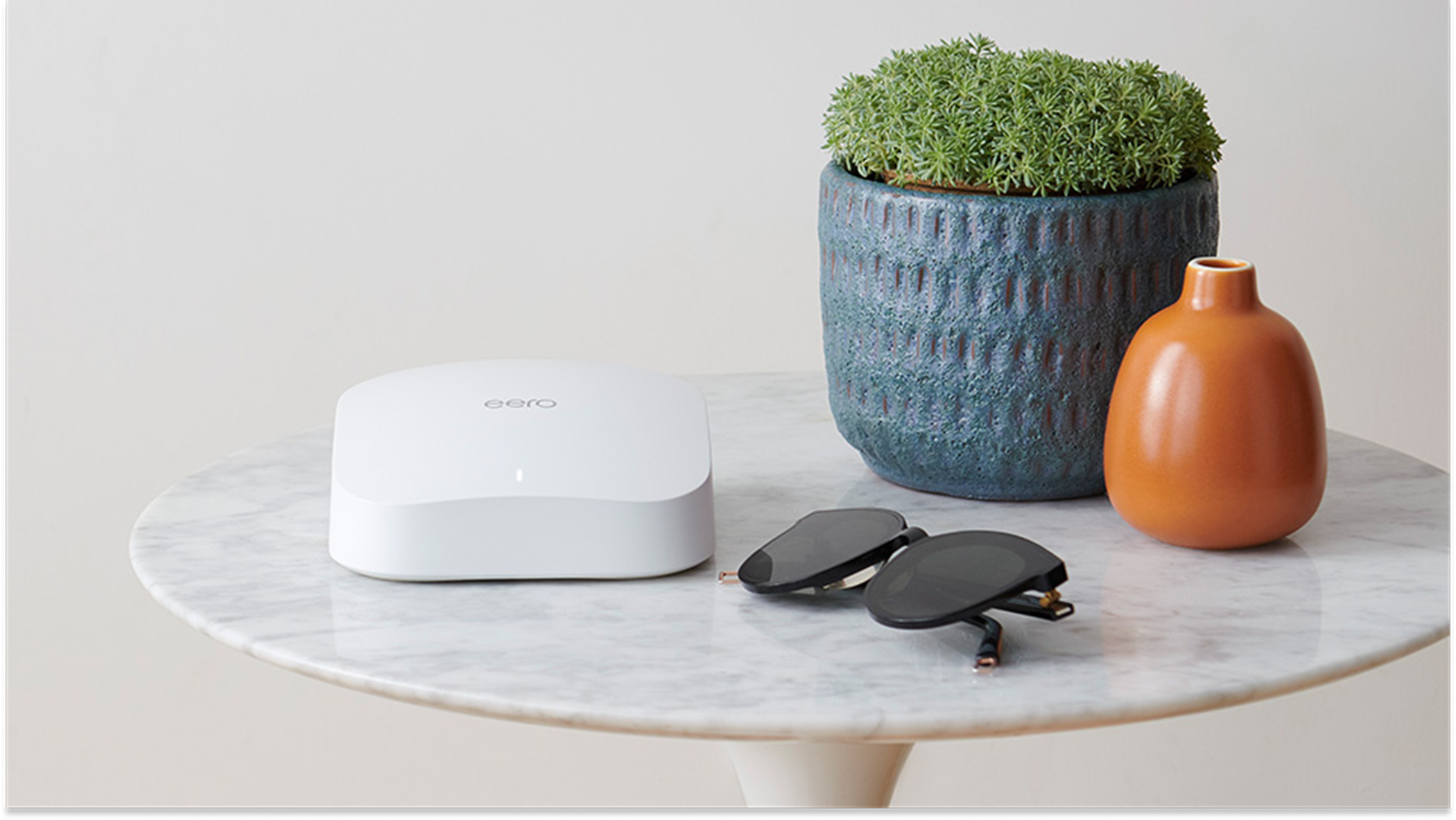 eero pro 6 wifi system on a side table