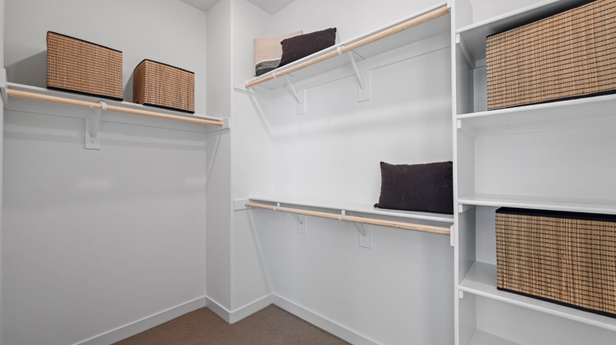 Walk in closet interior with wooden shelving