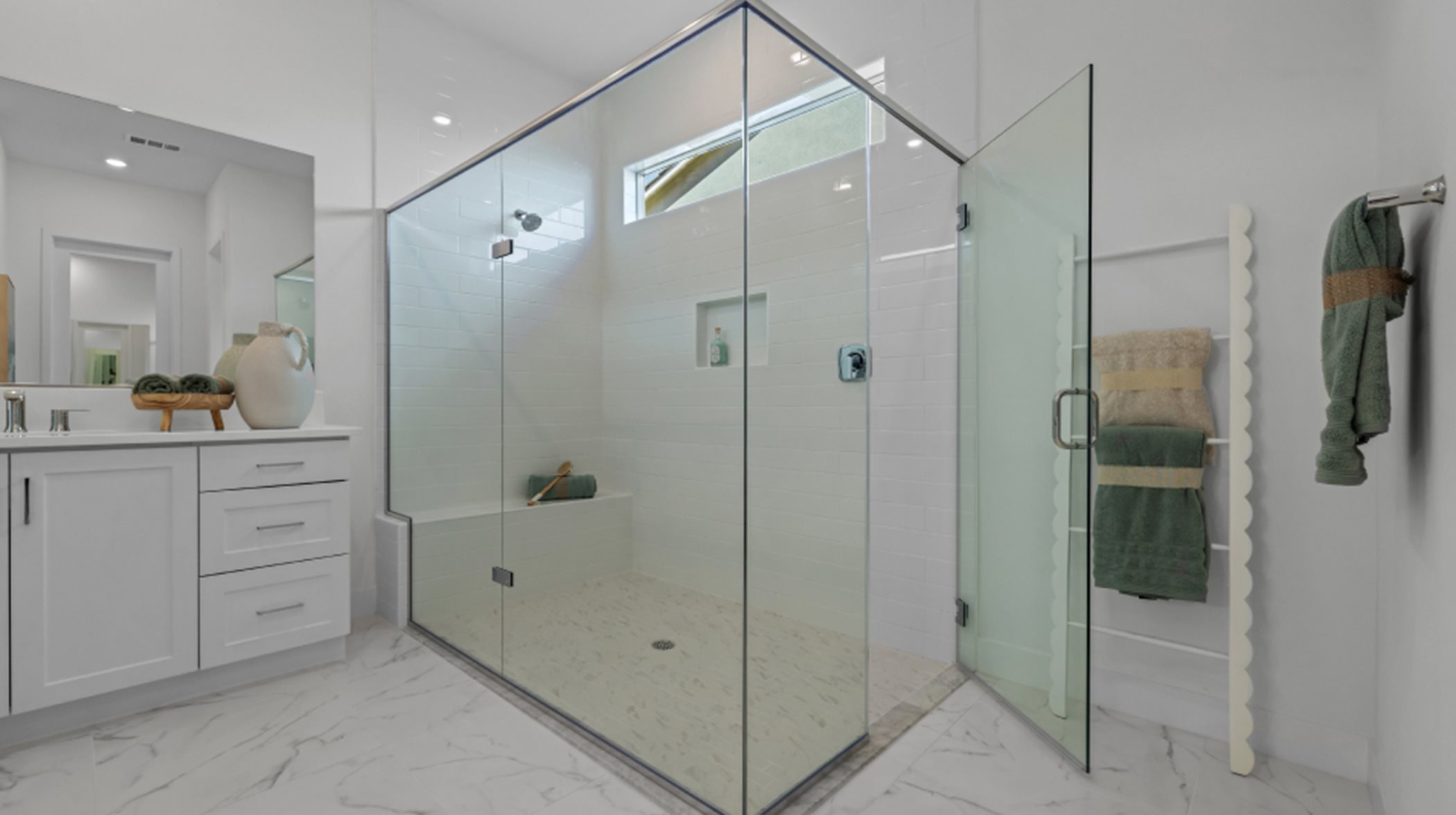Owner's shower with glass doors
