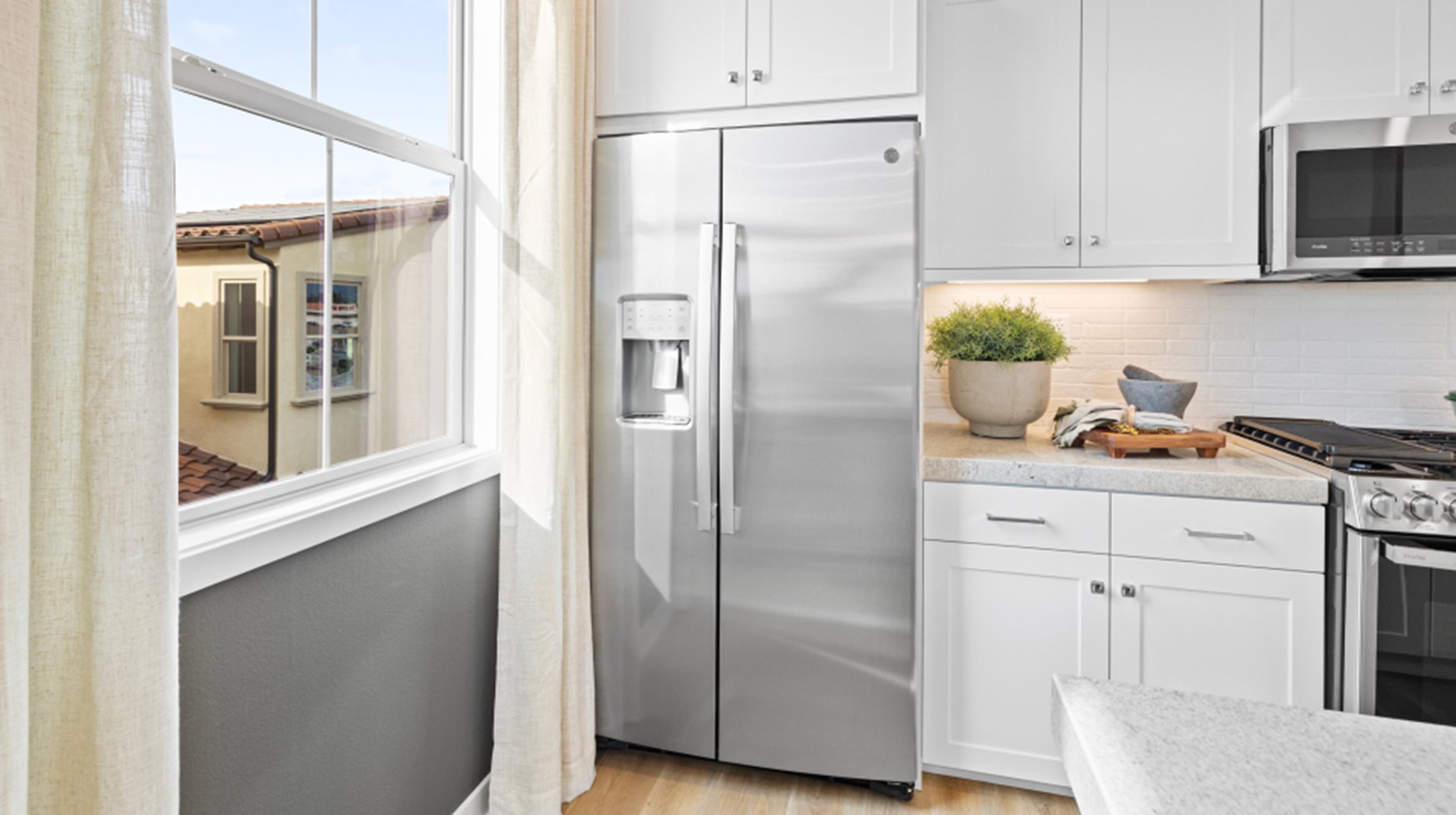 Image of kitchen with a focus on the fridge