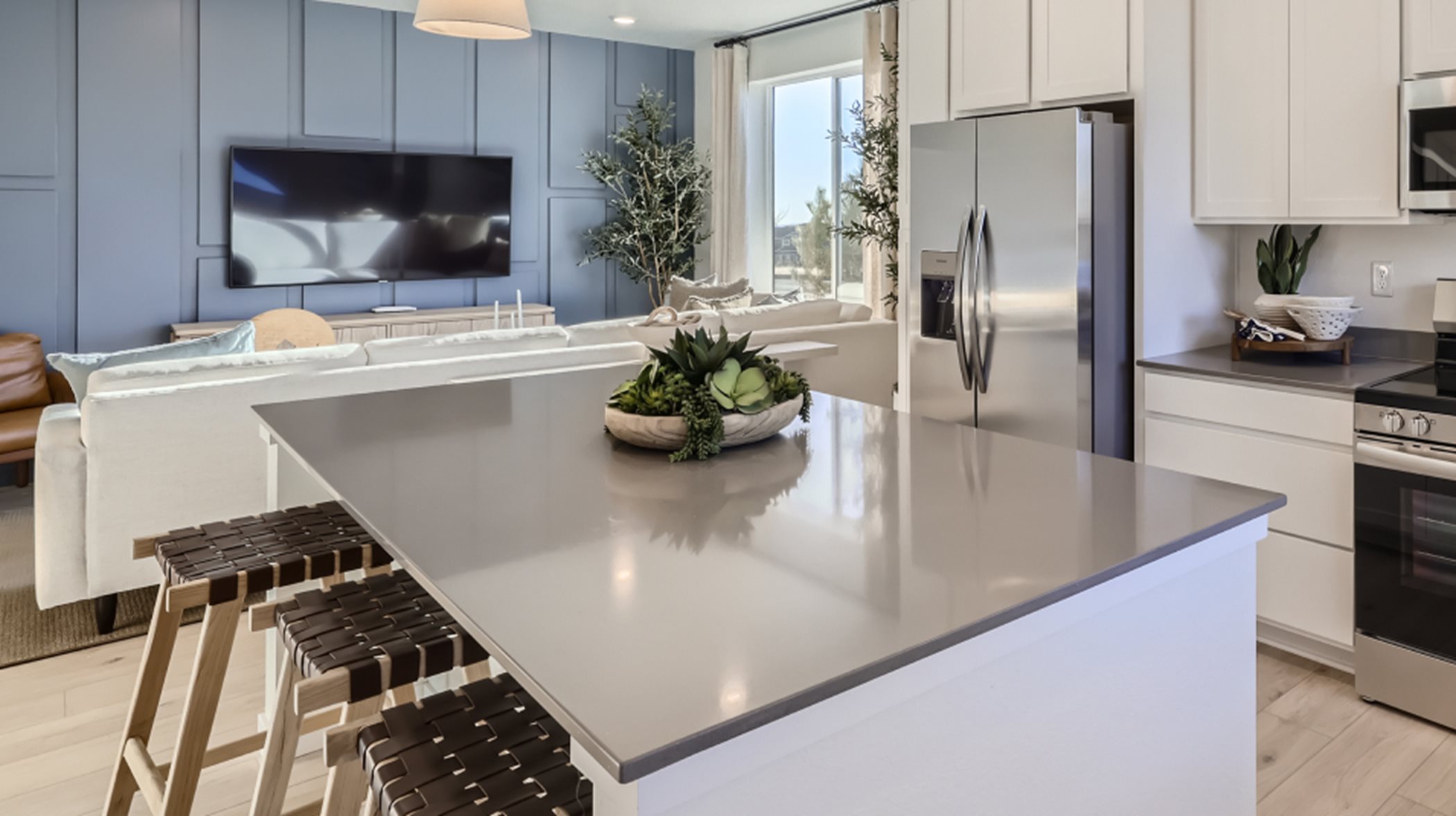 Sleek quartz countertops offer a heat and stain-resistant surface in kitchen