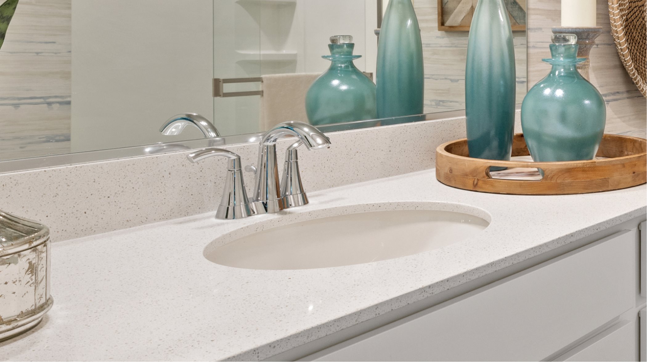 Quartz countertops and Moen® faucets at vanity 