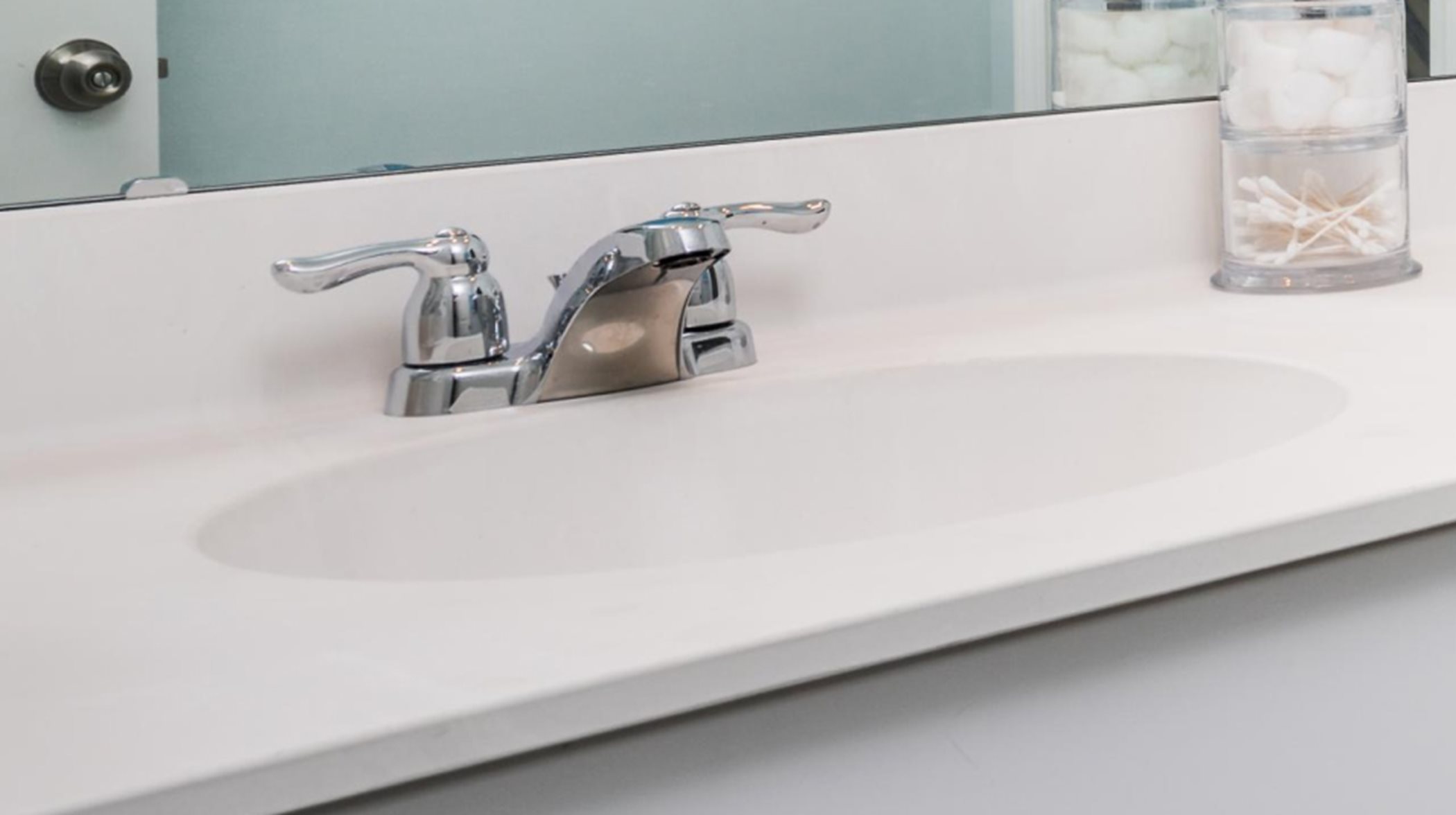 Undermount white bowls with stainless fixtures
