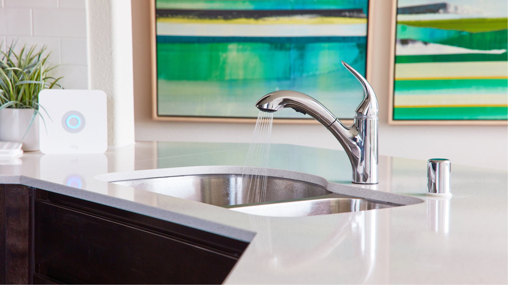 Chrome faucets and a stainless steel sink