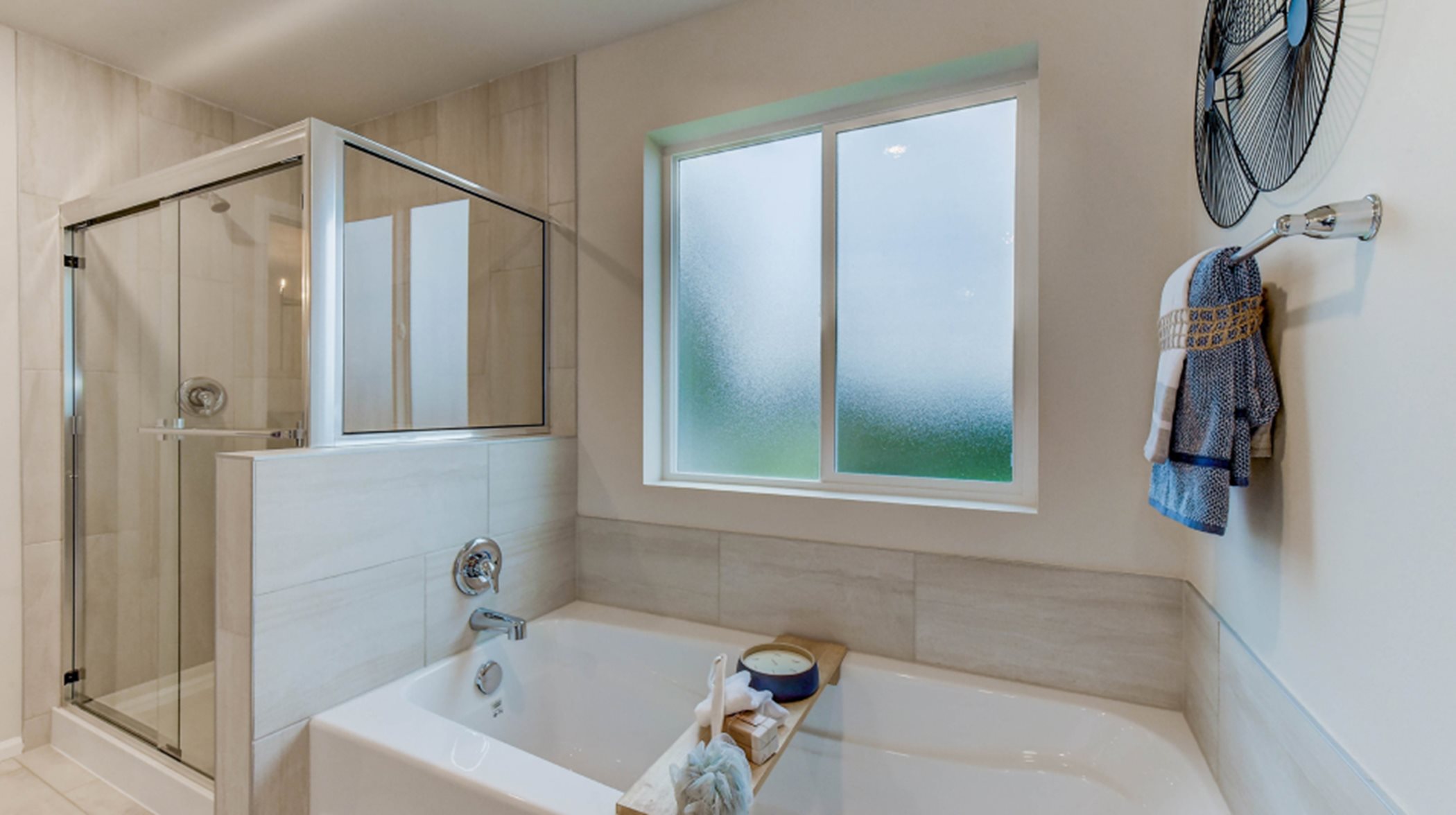 Soaking tub next to the glass enclosed shower