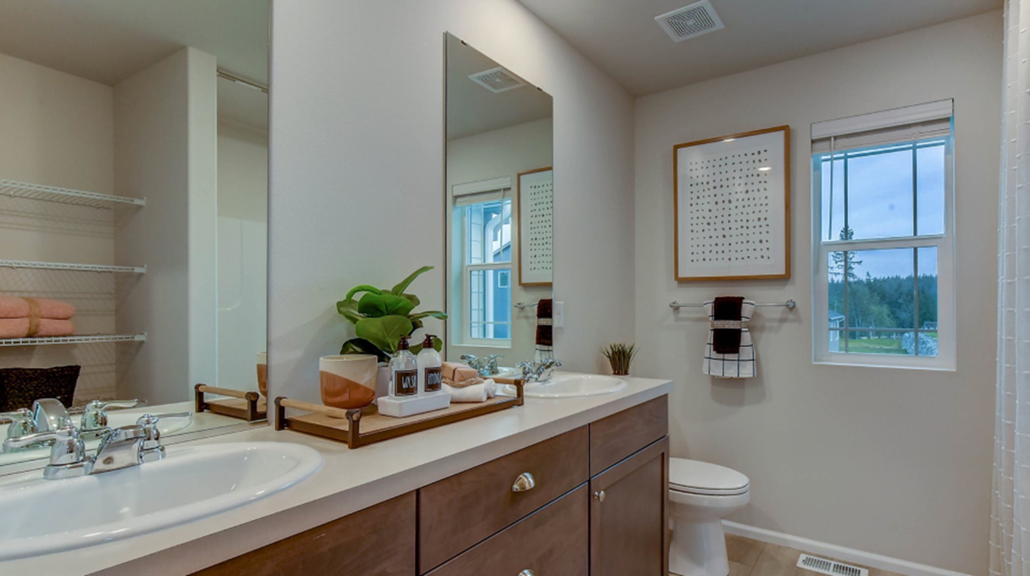 Bathroom sinks with framed mirrors above